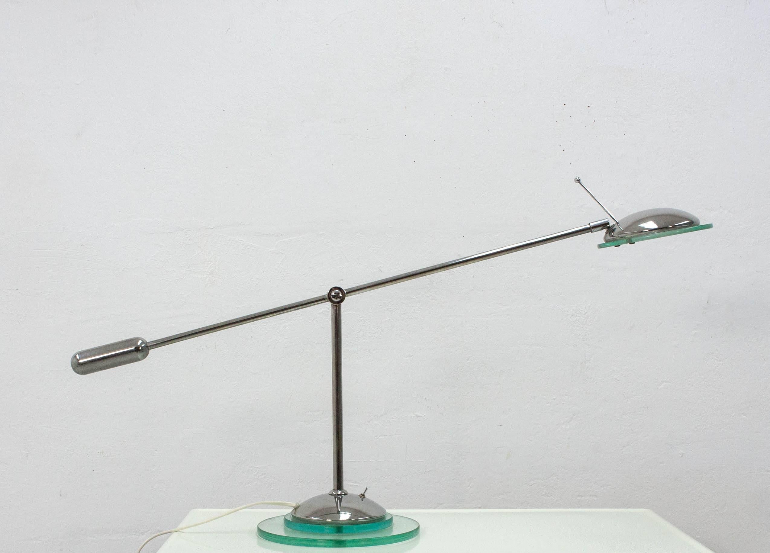 Very nice chrome counter balance desk light, Optelma Swiss. Chrome with thick
glass details. Good quality, two-way switch halogen, very good condition.