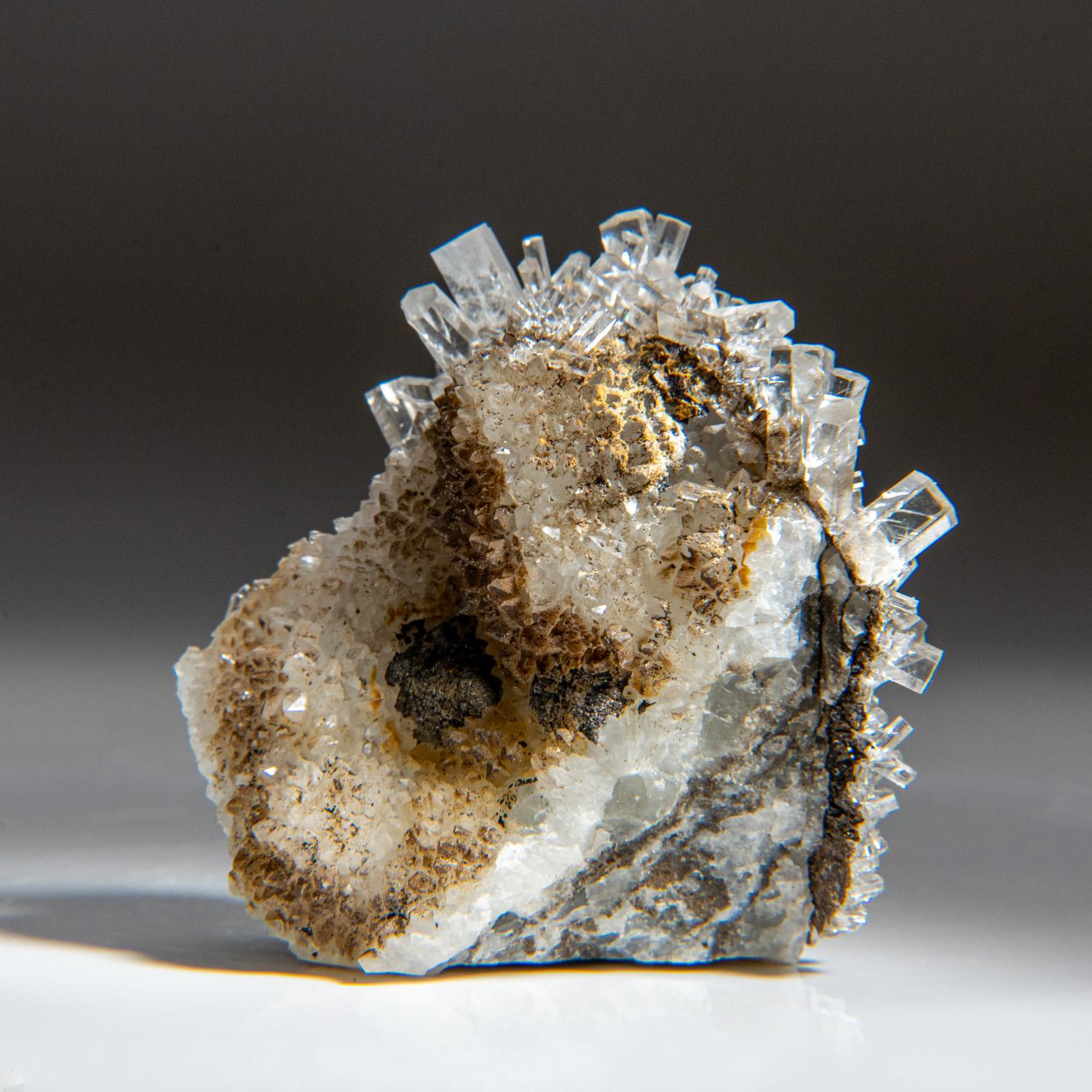 From Leiping Mine, Guiyang, Hunan, China Internally flawless crystal cluster of optical-grade colorless calcite on gossan matrix. The calcite crystal are fully terminated with hexagonal prism shape with a flat termination with water transparency