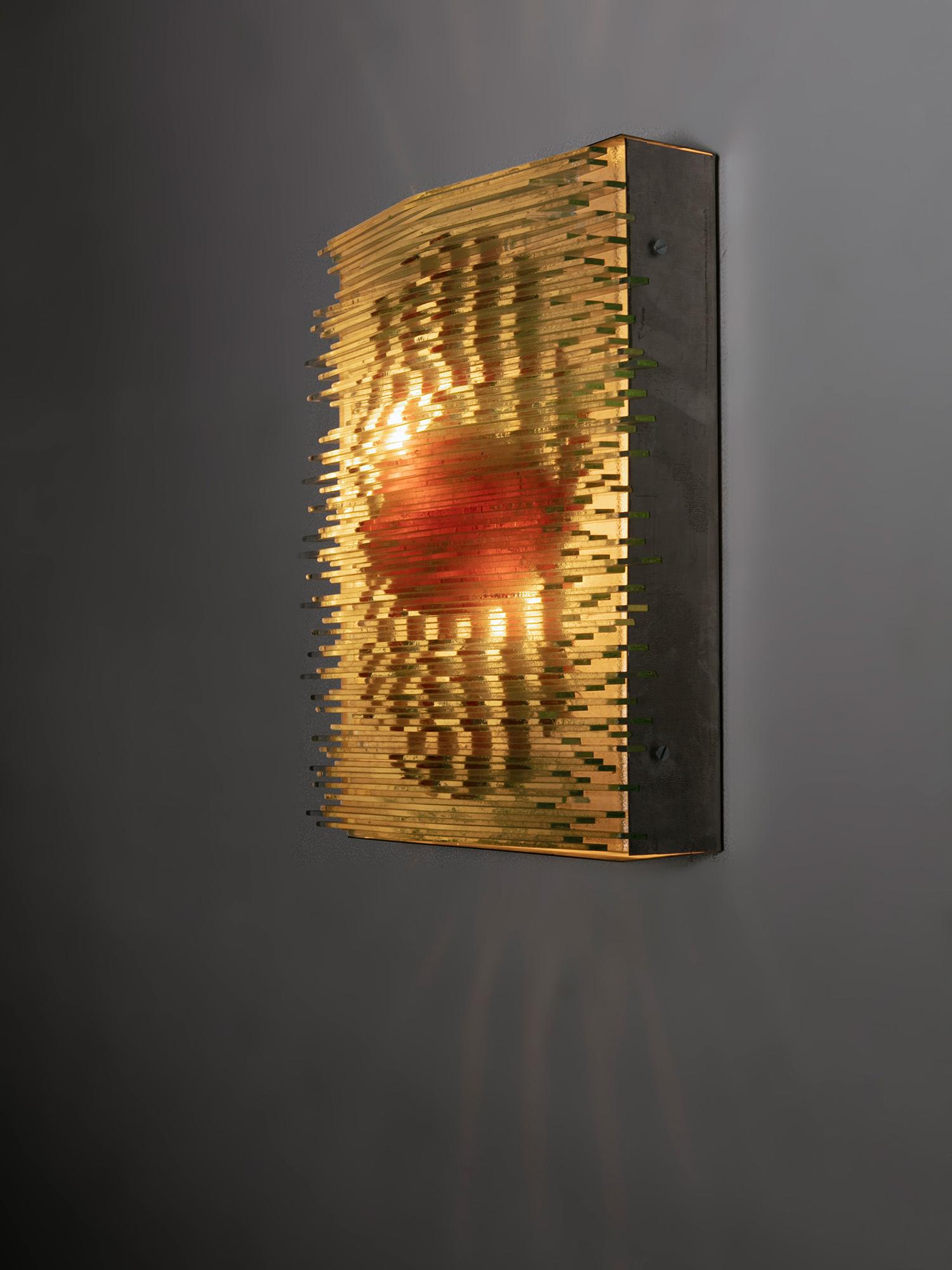 Murano glass wall lamp manufactured by Lumenform.
Thin colored glass layers create different shapes.
