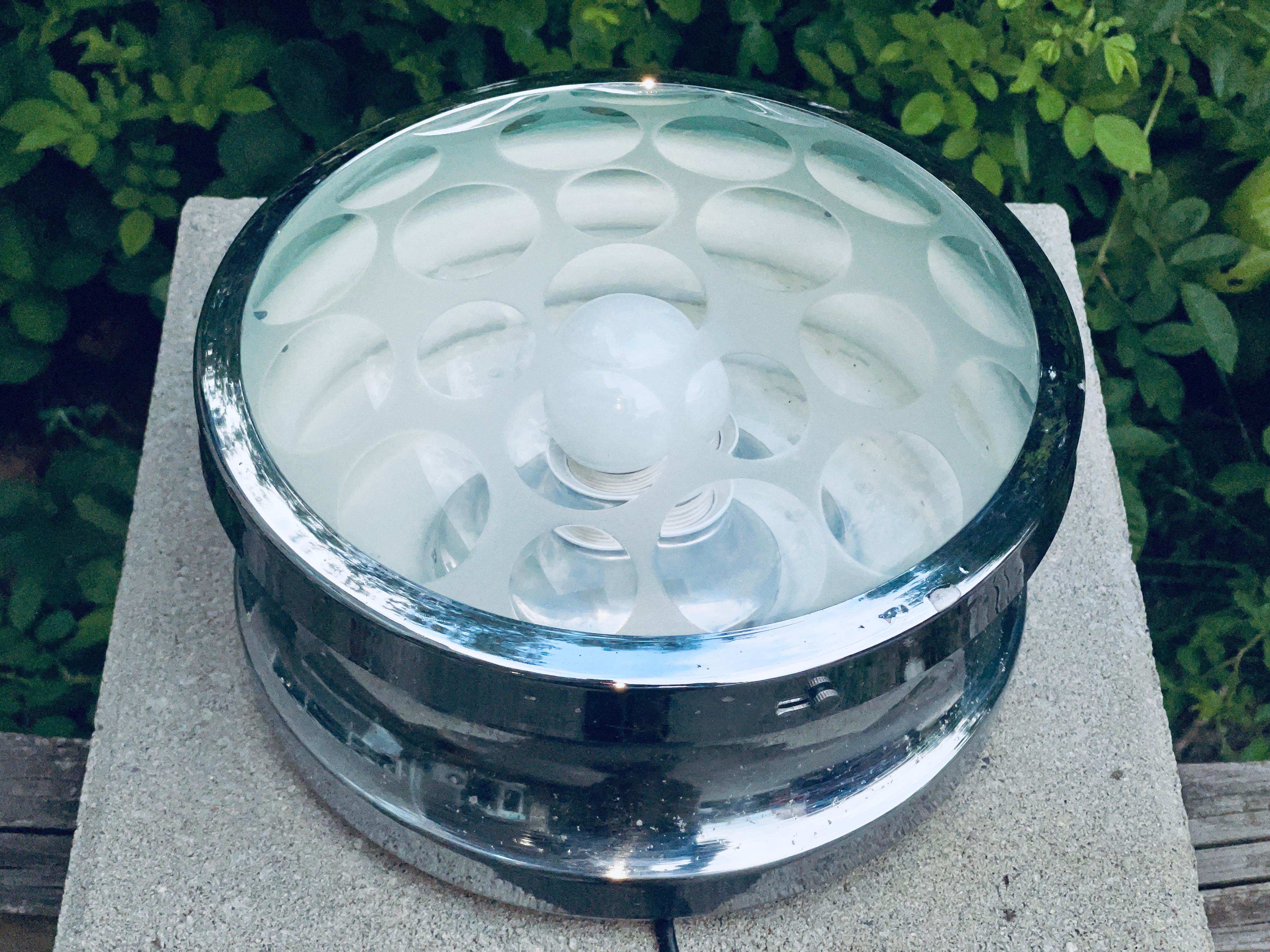 Multifaceted optic ground dome shaped lens set within a chrome plated wall or ceiling mounted fixture attributed to Pia Guidetti Crippa for Lumi Milano, circa 1960's.
Glass is perfect. Chrome plating has some pitting.
Can be used corded or