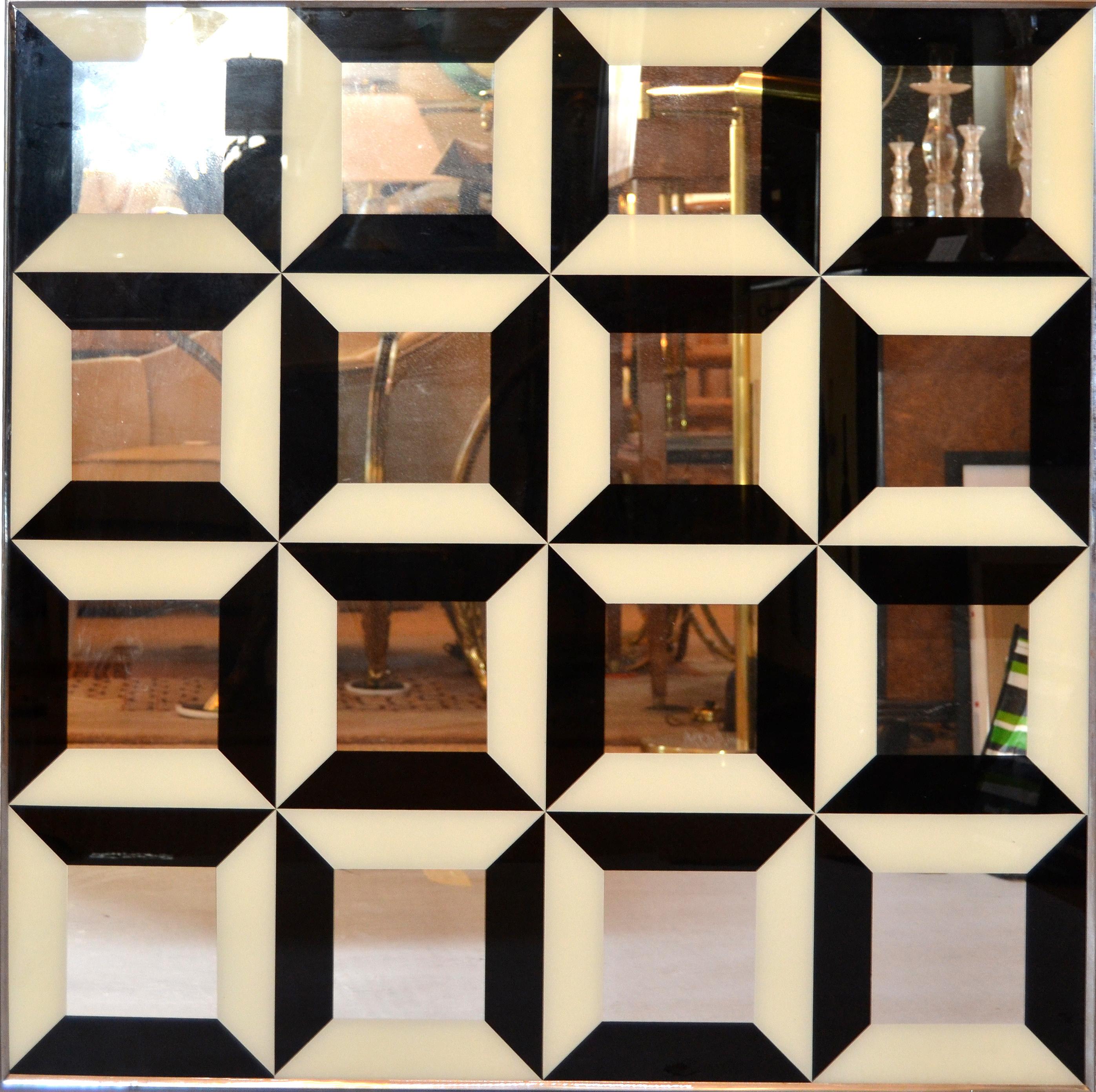 Mid-Century Modern diamond Pop Art mirror in optical illusion.
Black and white reverse painted design patterns on the mirror create a 3D optical illusion making it look like raised squares.
This pattern is influenced by Verner Panton.
Wired to be