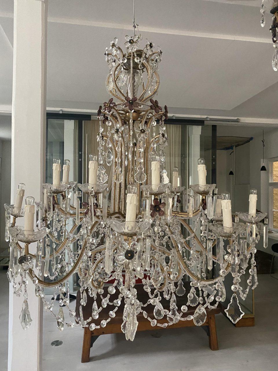 Fantastically beautiful and voluminous French prism ceiling lamp, from circa 1920s-30s. Generally seen in French chateaus and mansions, or grand hotels. The chandelier is a true opulence of clear prism branches and beautiful faceted prisms in