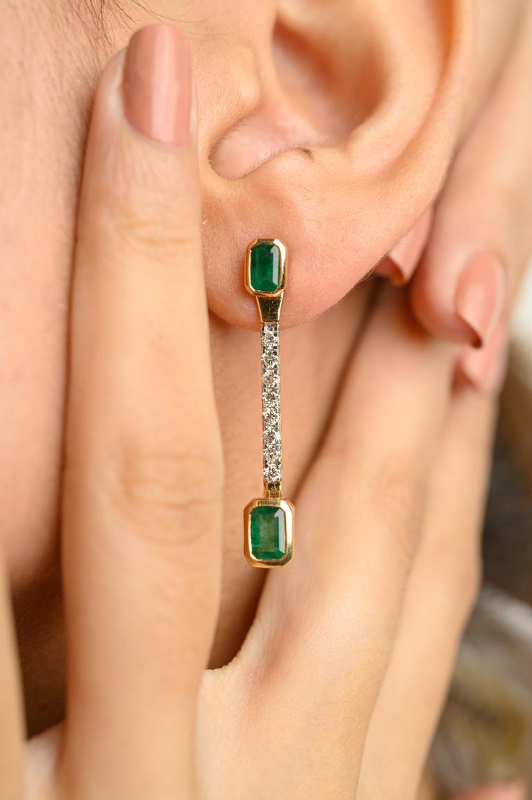 Natural Emerald Diamond Dangle Earrings in 18K Gold to make a statement with your look. These earrings create a sparkling, luxurious look featuring octagon cut emerald.
Emerald enhances intellectual capacity of the person. 
Designed with octagon cut