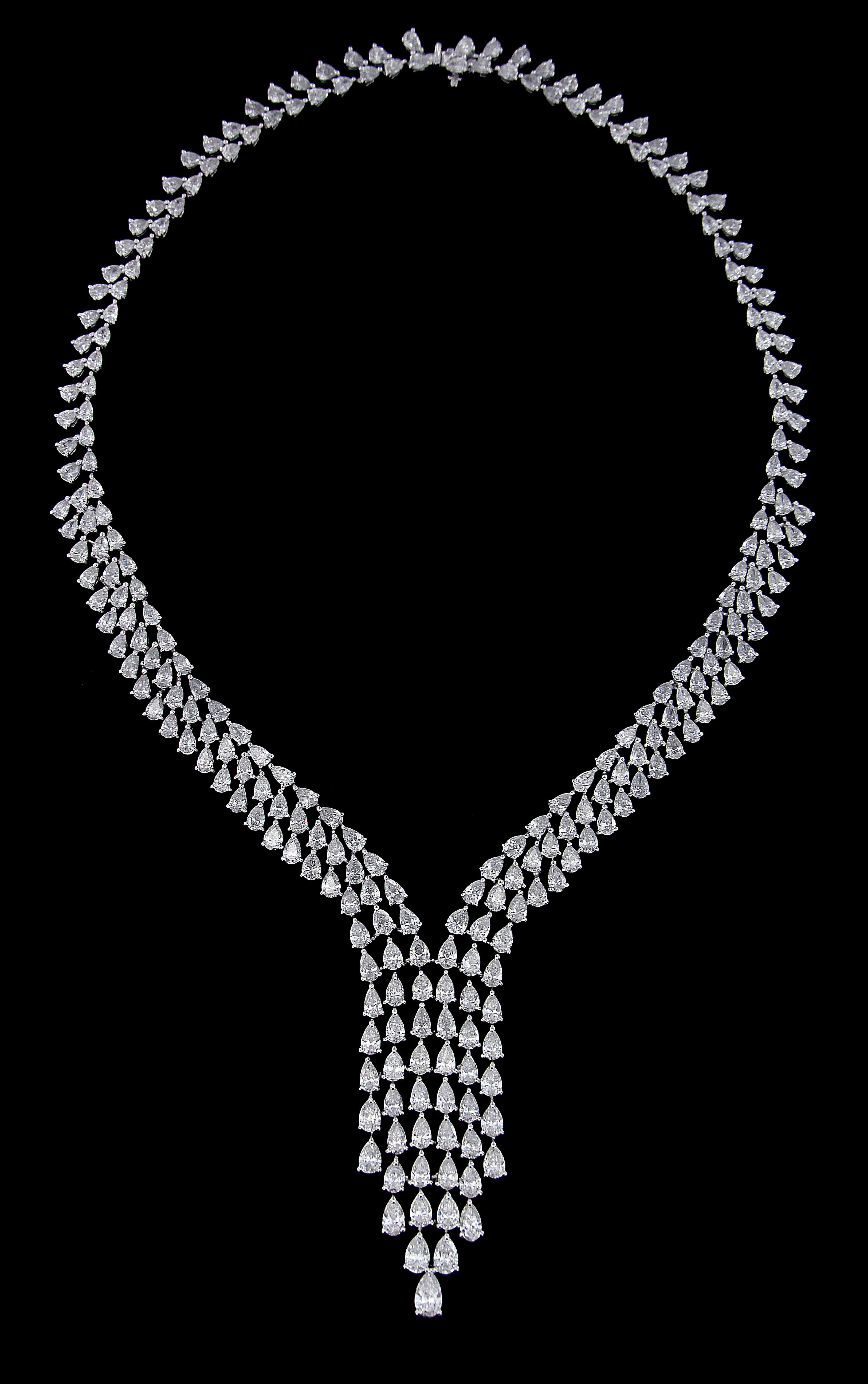 Opulent 18 Karat Gold And Diamond Multi Occasion Set :
Necklace:
Pear shaped diamonds of approximately 44.228 carats, mounted on 18 karat white gold necklace. The Necklace weighs approximately around 44.754 grams.


Please note: The charges