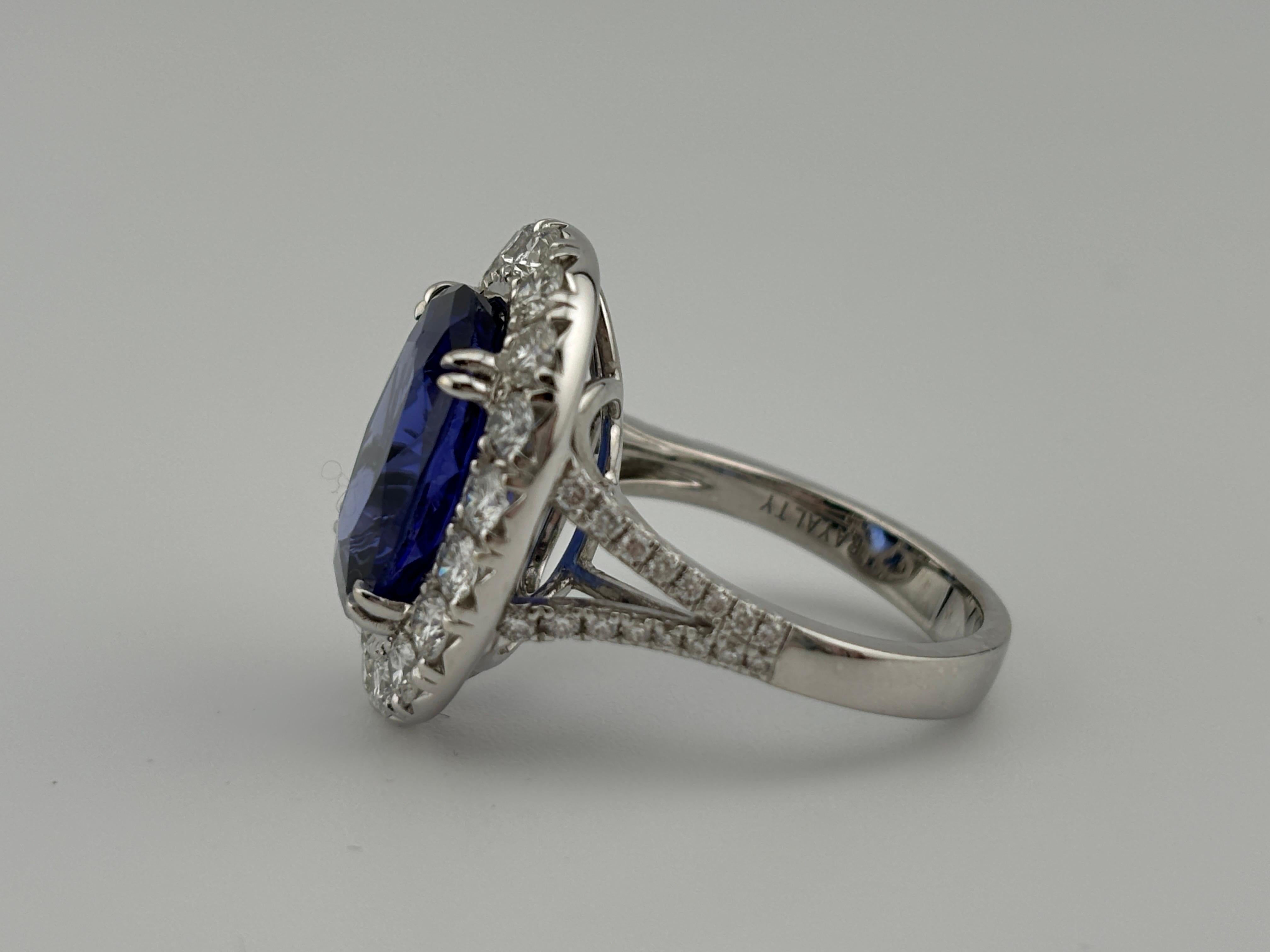 Absolutely breathtaking 18k white gold ring set with tanzanite that is surrounded by a lavish diamond halo that beautifully complements the allure of the tanzanite gemstone. Tanzanite can only be mined in Tanzania which makes it a rare and