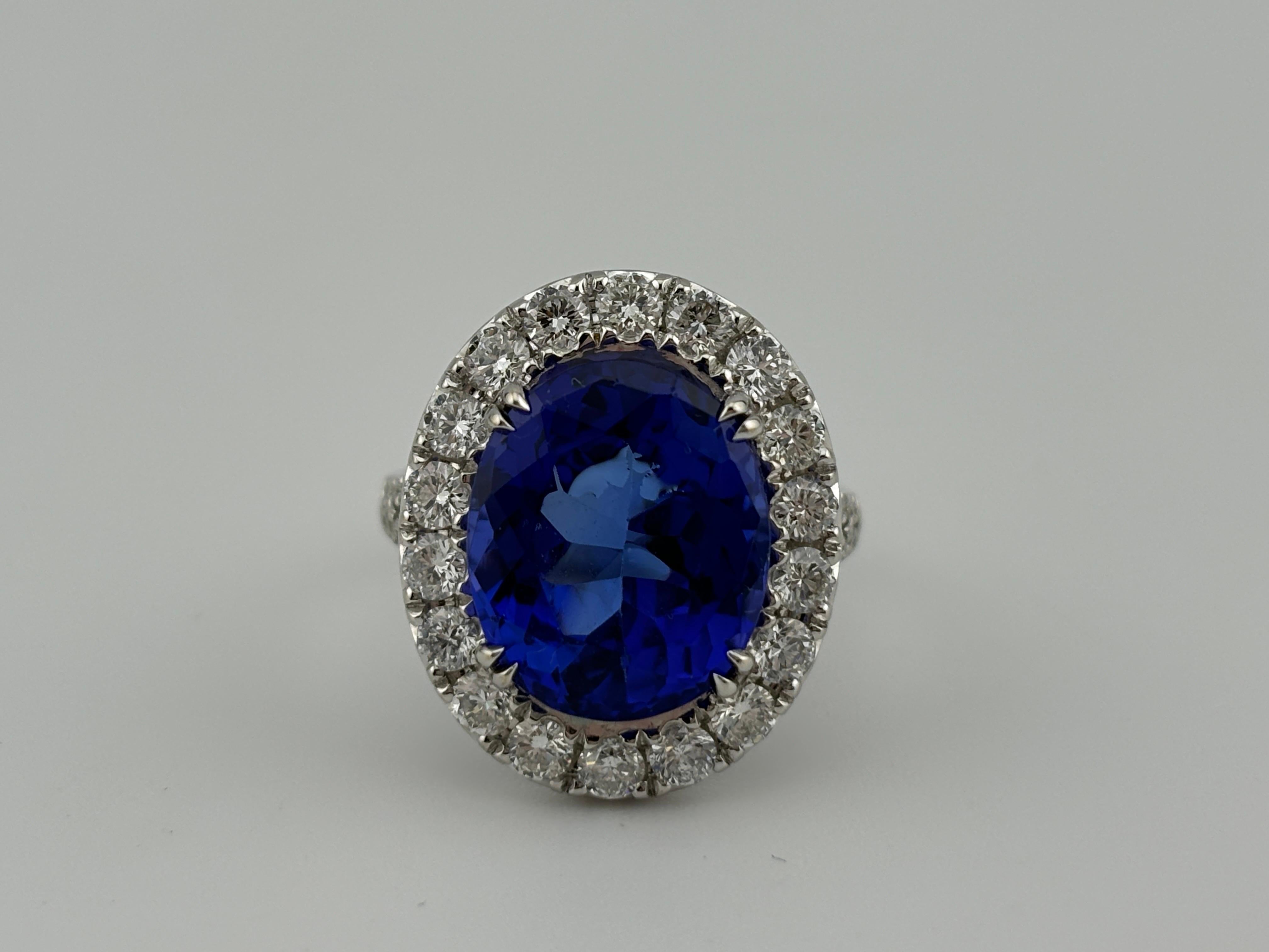 Contemporary Opulent 18k White Gold Tanzanite & Diamond Halo Cocktail Ring For Sale