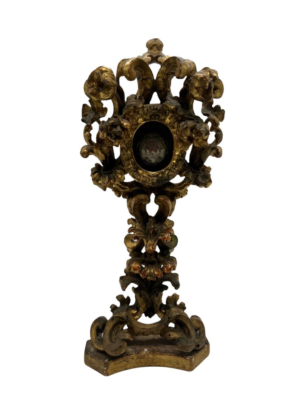 Opulent 18th century Baroque carved giltwood reliquary (a container for relics) monstrance with curled scroll design. It houses a first-class relic of the blood of the15th Century saint St. Francis de Paola (March 27th, 1416 – April 2nd, 1507).