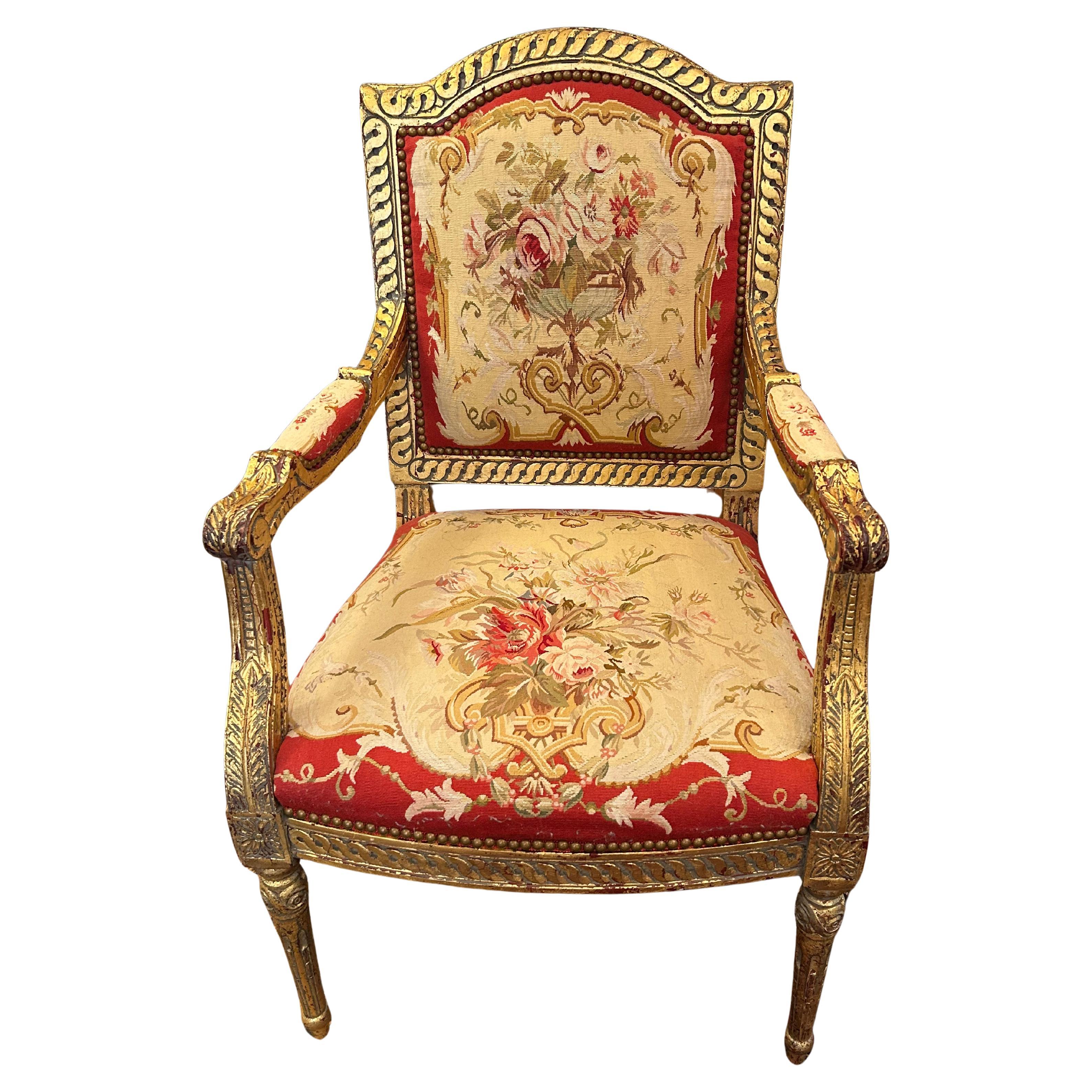 Opulenta poltrona in legno d
orato e arazzo realizzata per i reali