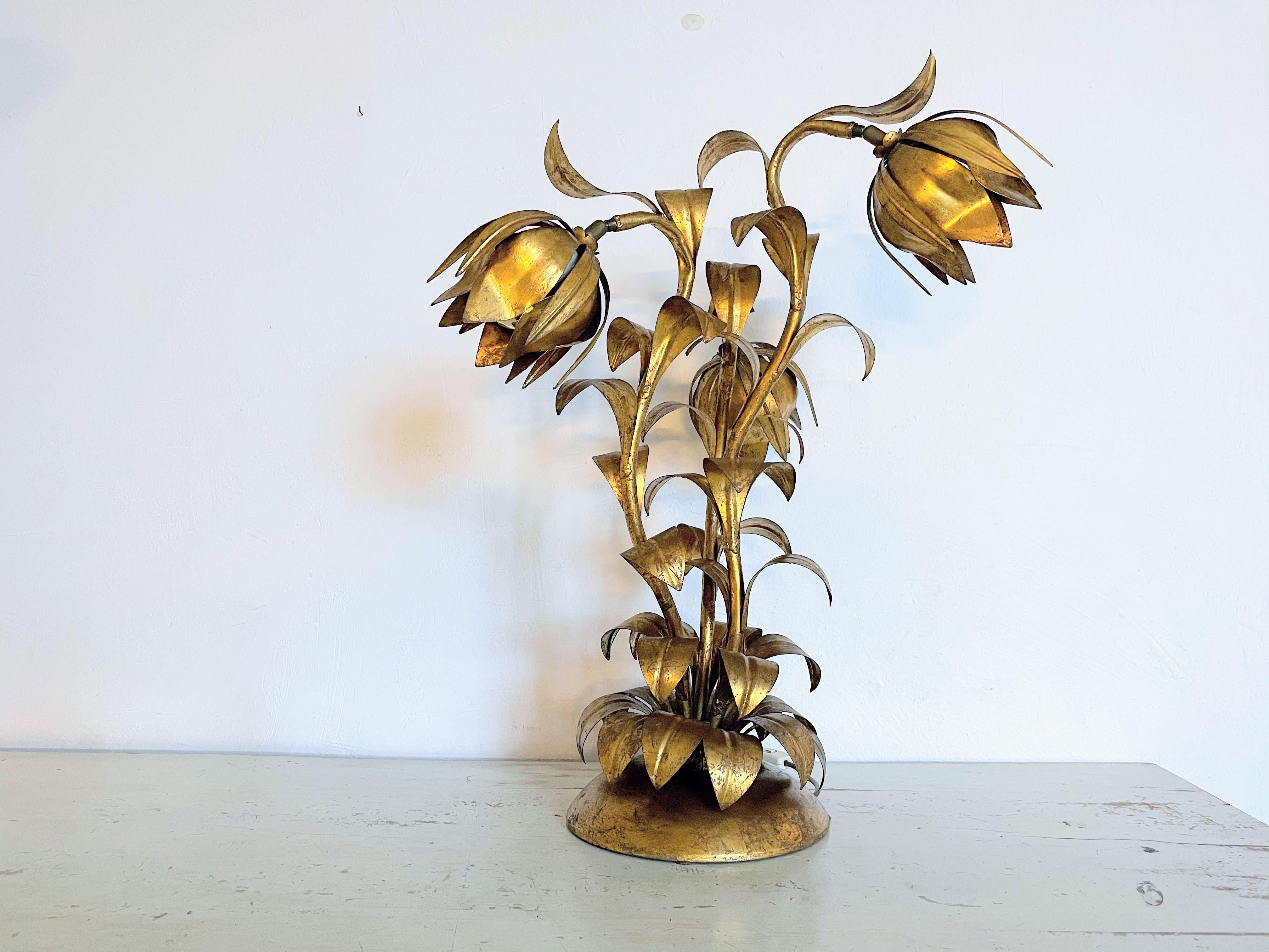 mmerse yourself in the world of timeless glamour with our opulent table lamp in Hollywood Regency style, embodying a three-stemmed flower design attributed to Koegl.

This artful lamp seamlessly blends playful design with extravagant elegance.