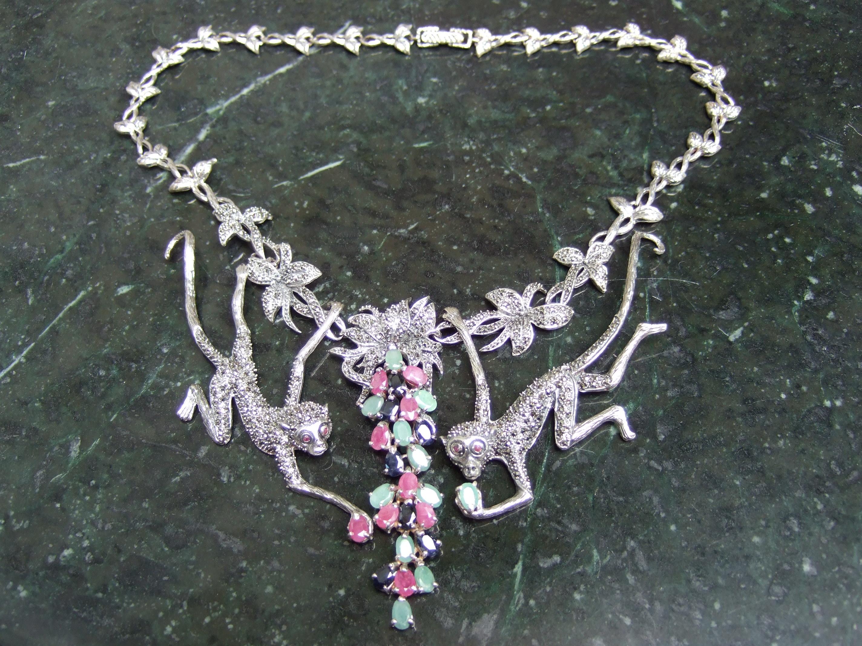 Opulent jewel encrusted sterling silver articulated monkey choker necklace 21st c 
The exquisite avant-garde necklace is designed with a pair of stylized monkey's embellished with glittering marcasite crystals. Accented with semi-precious prong set