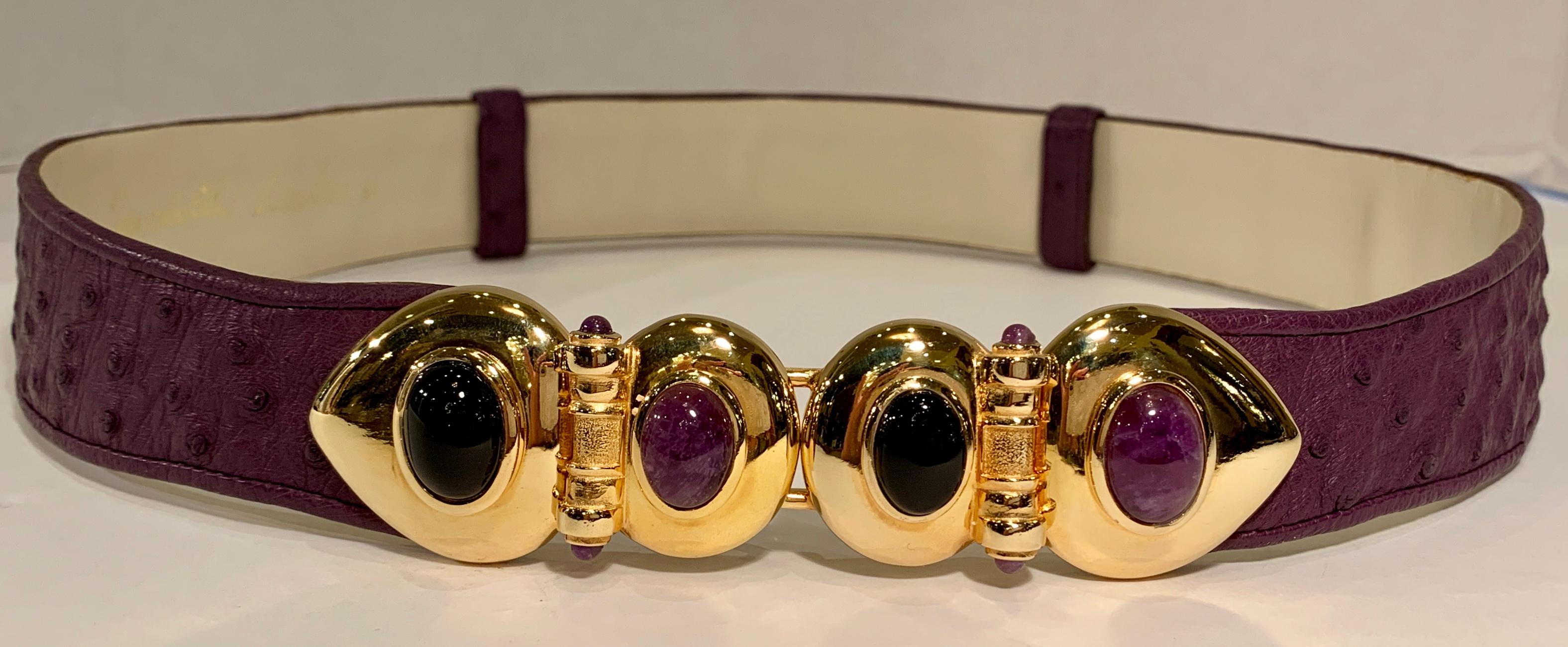 Known for her amazing purses, Judith Leiber’s creativity continued with accessories such as this beautiful estate adjustable belt from the 1980s with opulent semi-precious stone-studded, hinged gold-tone metal belt buckle. Adjustable belt is plum or