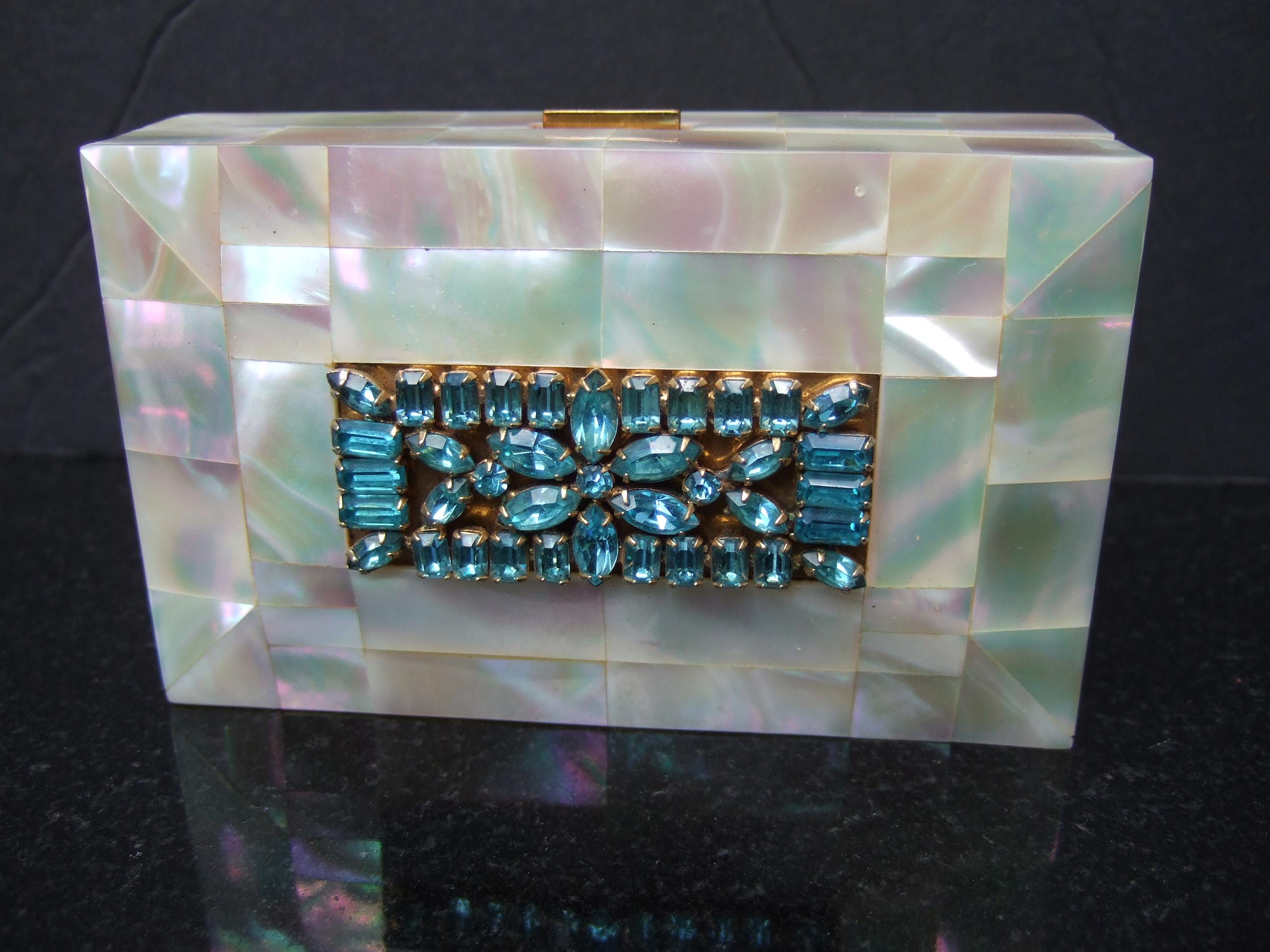 Opulent mother of pearl crystal encrusted evening bag- compact  case designed by Eligin c 1950s 
The elegant evening purse - cosmetic case is designed with exotic mother of pearl 
tiles throughout the exterior 

The lid cover is encrusted with
