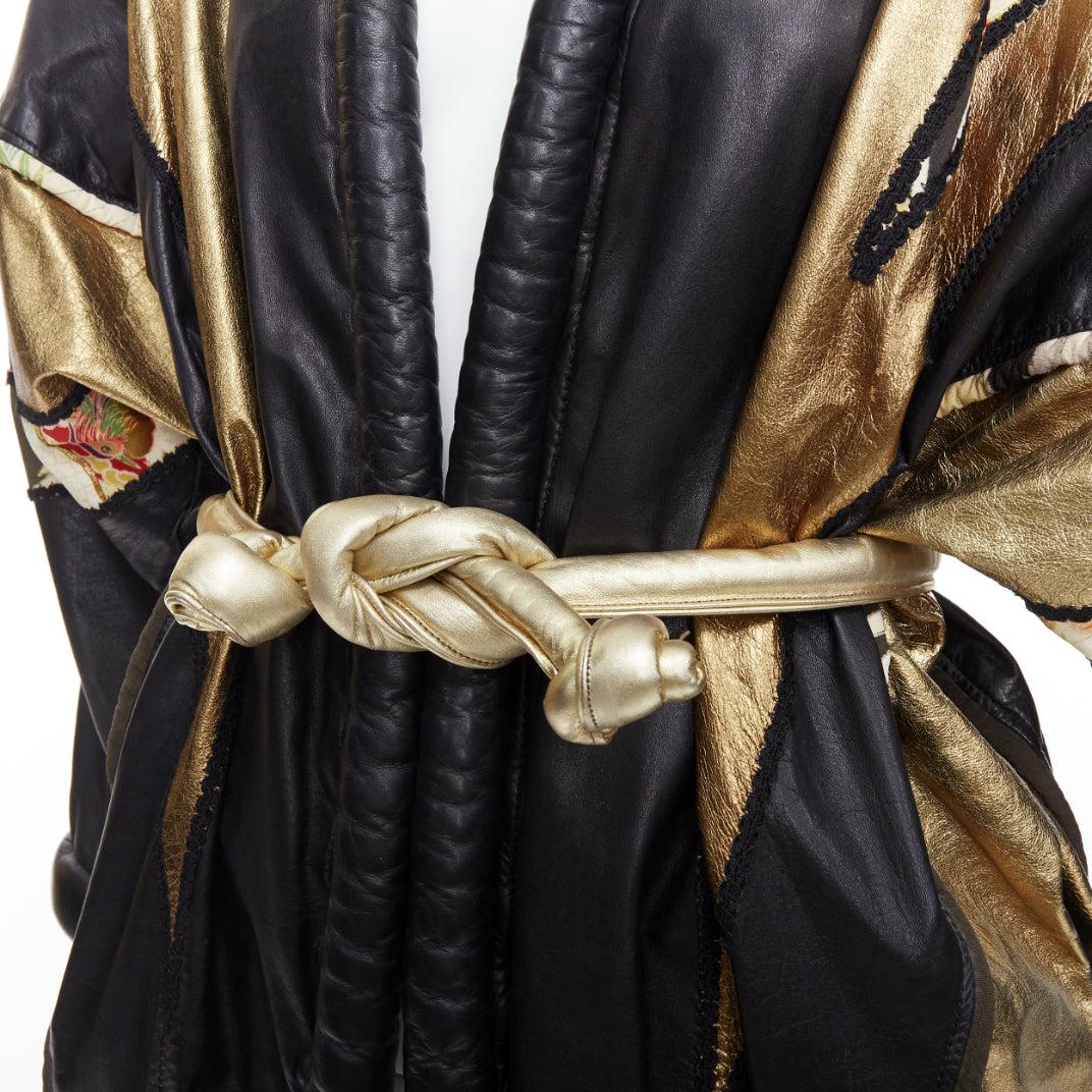 OPULENT Vintage gold black leather oriental patchwork belted coat
Reference: BMPA/A00277
Brand: Opulent
Material: Leather, Fabric
Color: Black, Gold
Pattern: Oriental
Closure: Belt
Lining: Black Fabric
Extra Details: Oriental fabric and leather