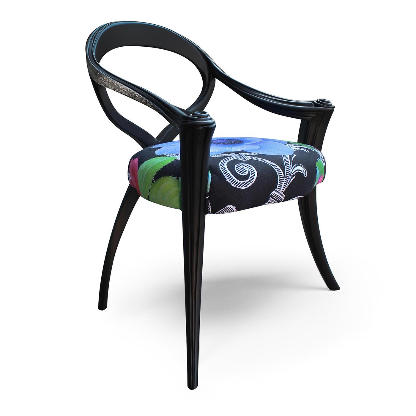 Indulge in the opulent Opus Chair Black Flower designed by Carlo Rampazzi. This exquisite piece boasts a meticulously carved wooden frame, finished with a sumptuous matte black lacquer. The lavish upholstery showcases the exclusive Black Flower