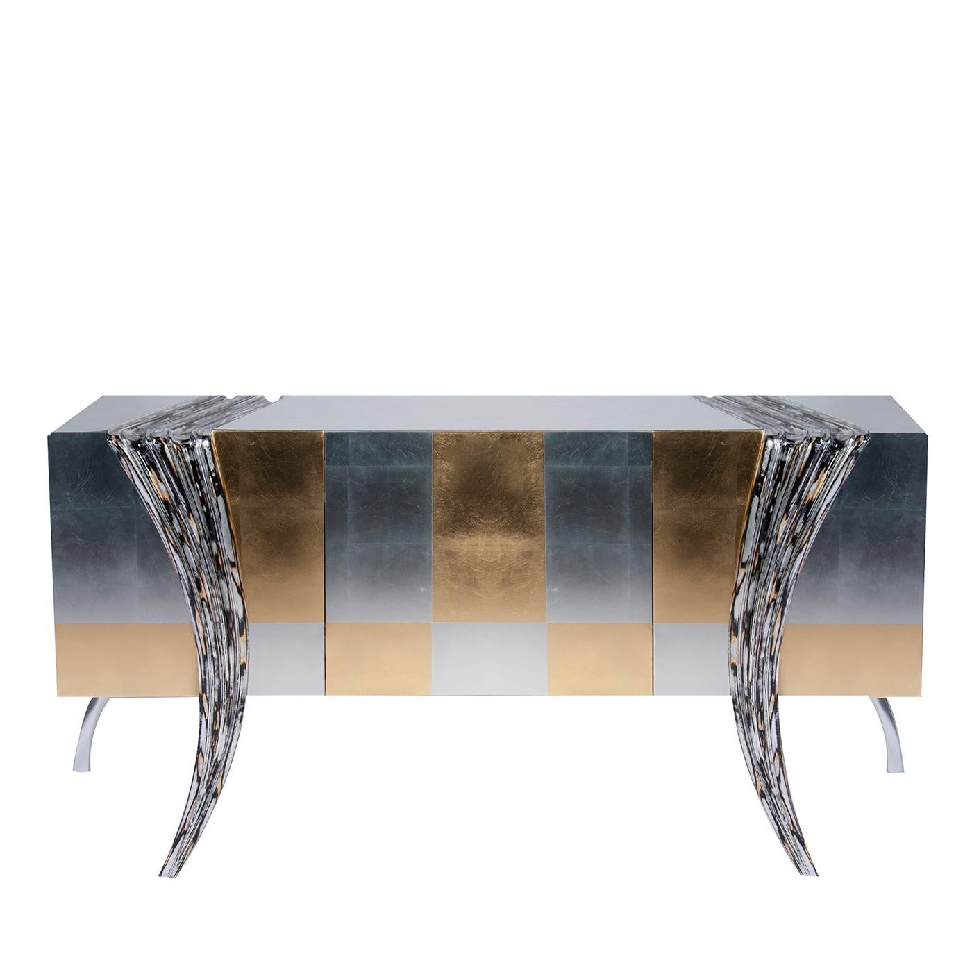 A captivating statement piece in a modern and eclectic interior, this superb sideboard has a rectangular wooden frame featuring two central doors decorated with a sophisticated checkered pattern with silver and gold foils. Flanking the unit in a