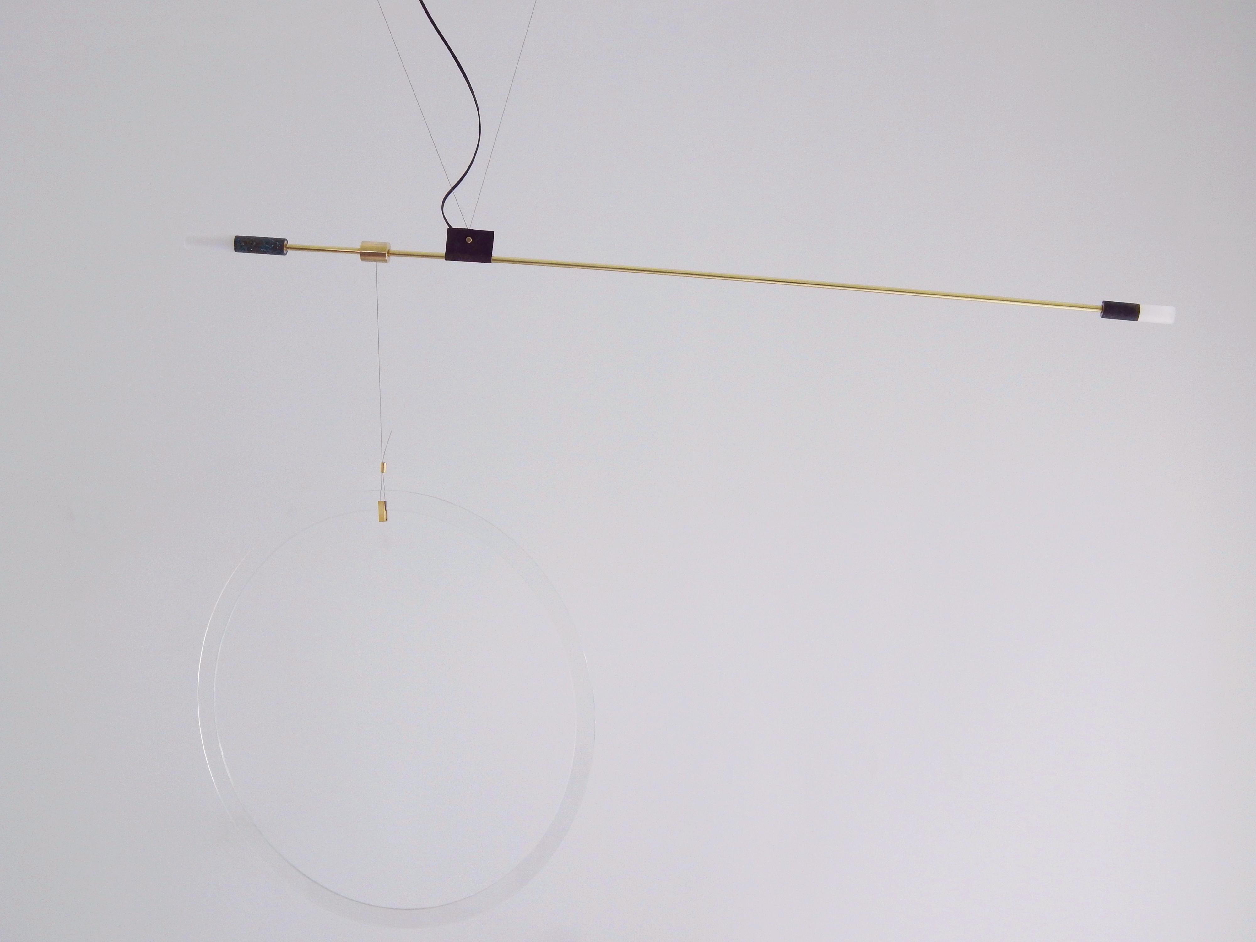 Opus III pendant lamp by Periclis Frementitis
Materials: polished brass, oxidized brass, acrylic tube parts, G4 LED bulb.
Dimensions: W 130 x H 80 x D 3 cm.

Due to the handmade nature of this product dimensions may vary up to 10% for balancing