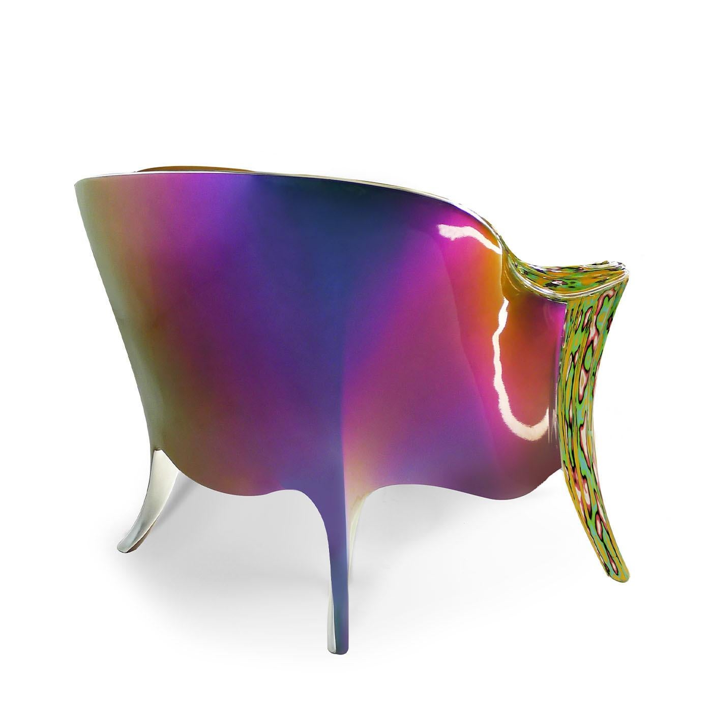 Crafted with a gracefully curved wood frame, this stunning armchair by Carlo Rampazzi flaunts intricately carved details that exude elegance from every angle. The back of the chair boasts a mesmerizing iridescent lacquer finish, while the armrests