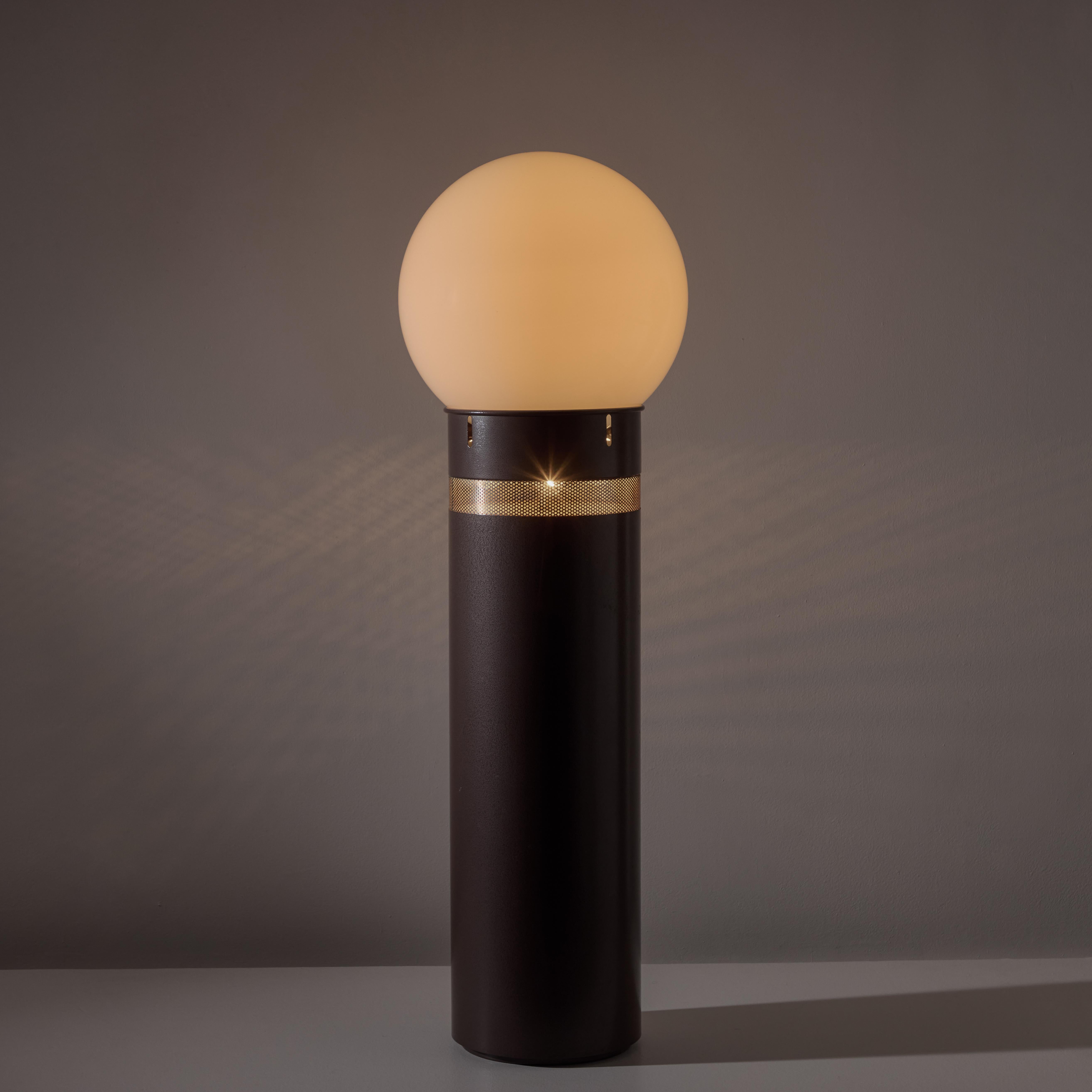 'Oracolo' Floor Lamp by Gae Aulenti for Artemide. Designed and manufactured in Italy, 1969. Totem style floor lamp with a brown powder coated base and a large opaline glass globe. The light features perforation detailing and a dual switch