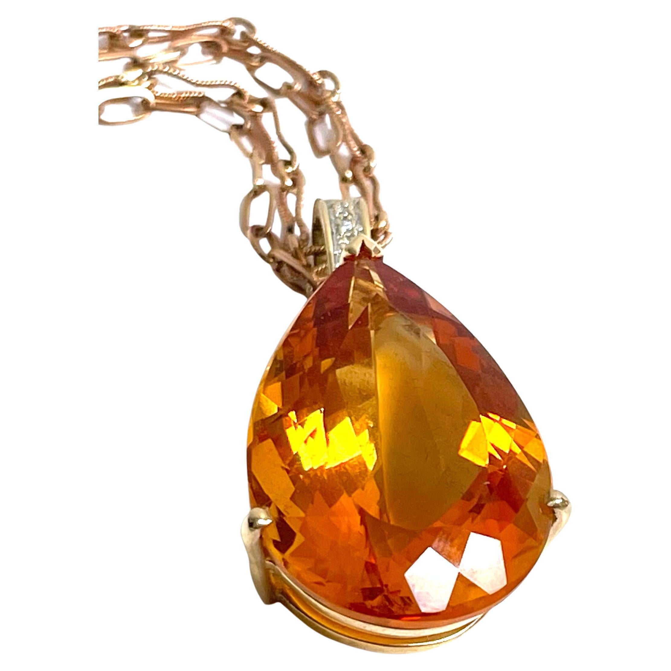Description
Vividly vibrant, exquisitely elegant, magnificently majestic and simply sublime; if this reflects your style, then this necklace is your ideal adornment. The rare flawless 80 carat faceted pear shape Mandarin Citrine radiates rich fiery