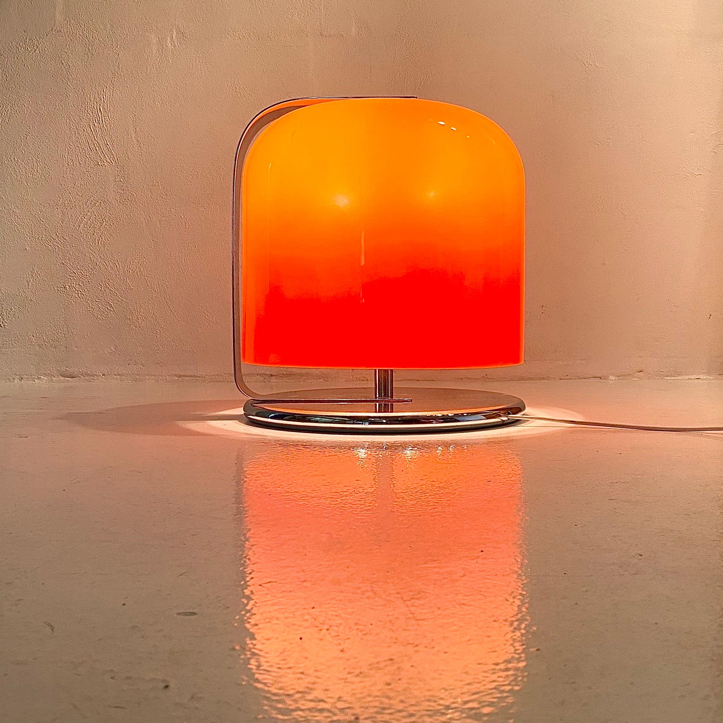 Super rare orange version of the iconic Alvise by Luigi Massoni for Guzzini, Italy 1960s. 

Huge in size and could easily be used as a low floor lamp. 

Made from thick orange plastic and plated chrome metal. The large wide chrome part do swivel