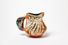 Orange and black glazed ceramic pitcher, circa 1950-1960.