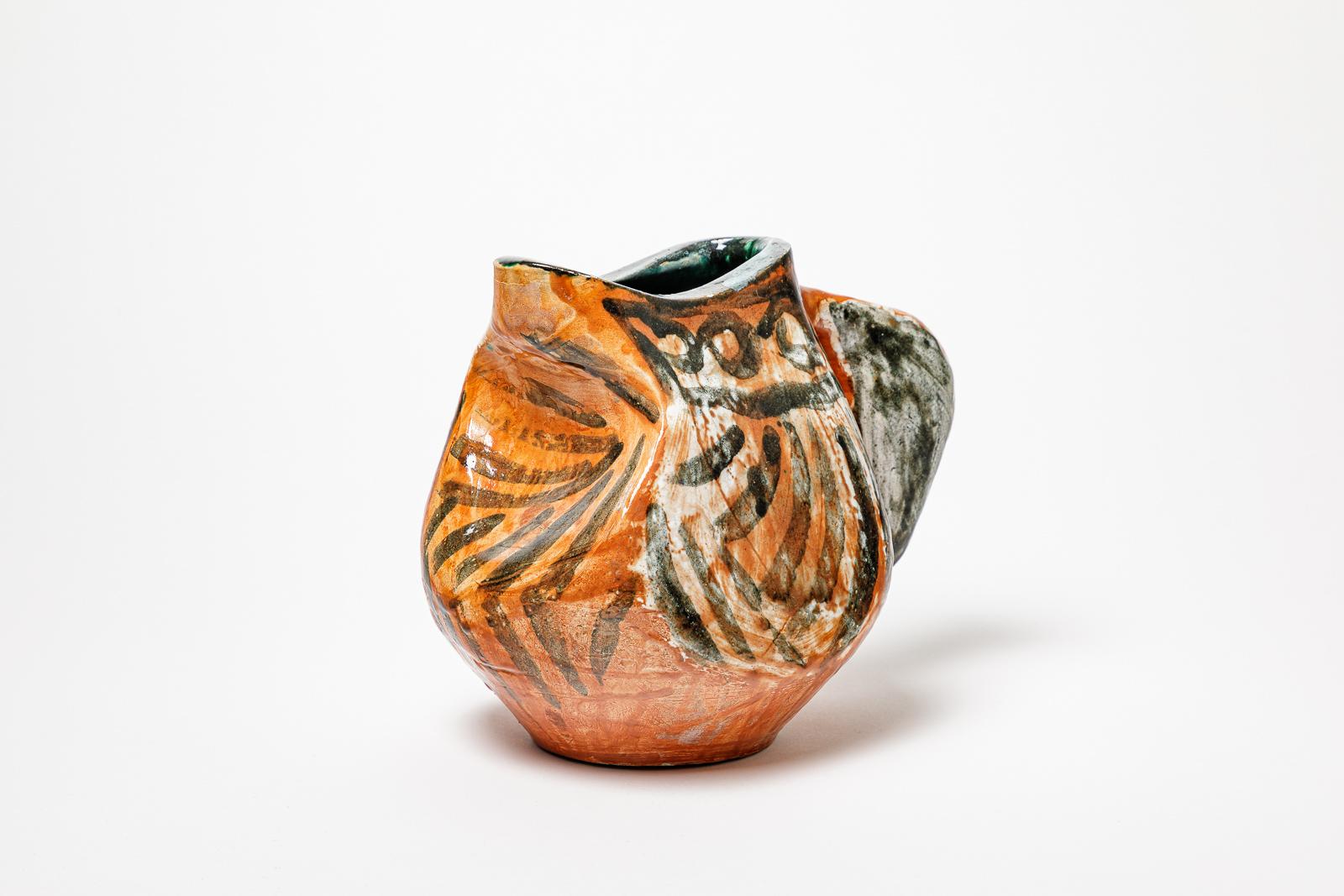French Orange and black glazed ceramic pitcher, circa 1950-1960. For Sale