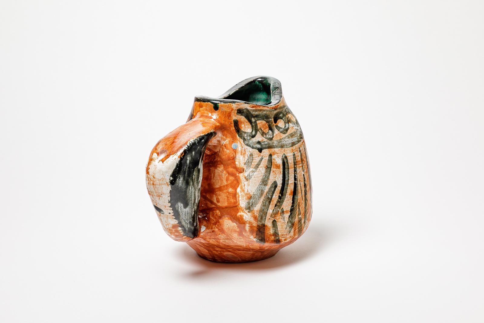 Ceramic Orange and black glazed ceramic pitcher, circa 1950-1960. For Sale