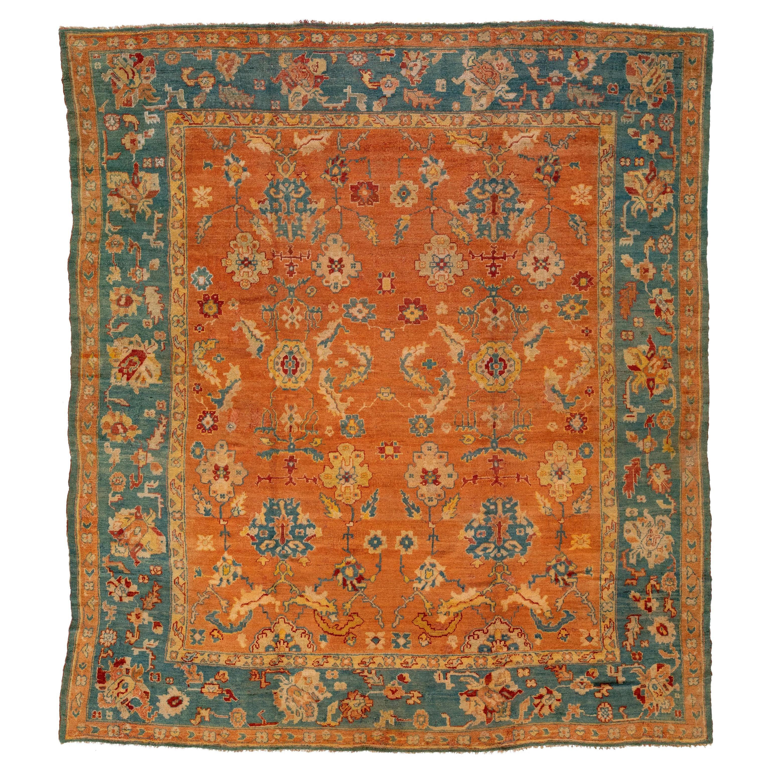 Tapis turc ancien en laine d'Oushak orange et bleu fabriqué à la main dans les années 1880 en vente