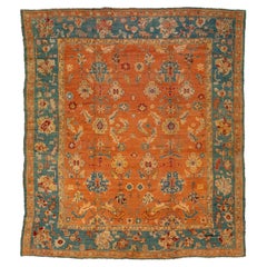 Tapis turc ancien en laine d'Oushak orange et bleu fabriqué à la main dans les années 1880