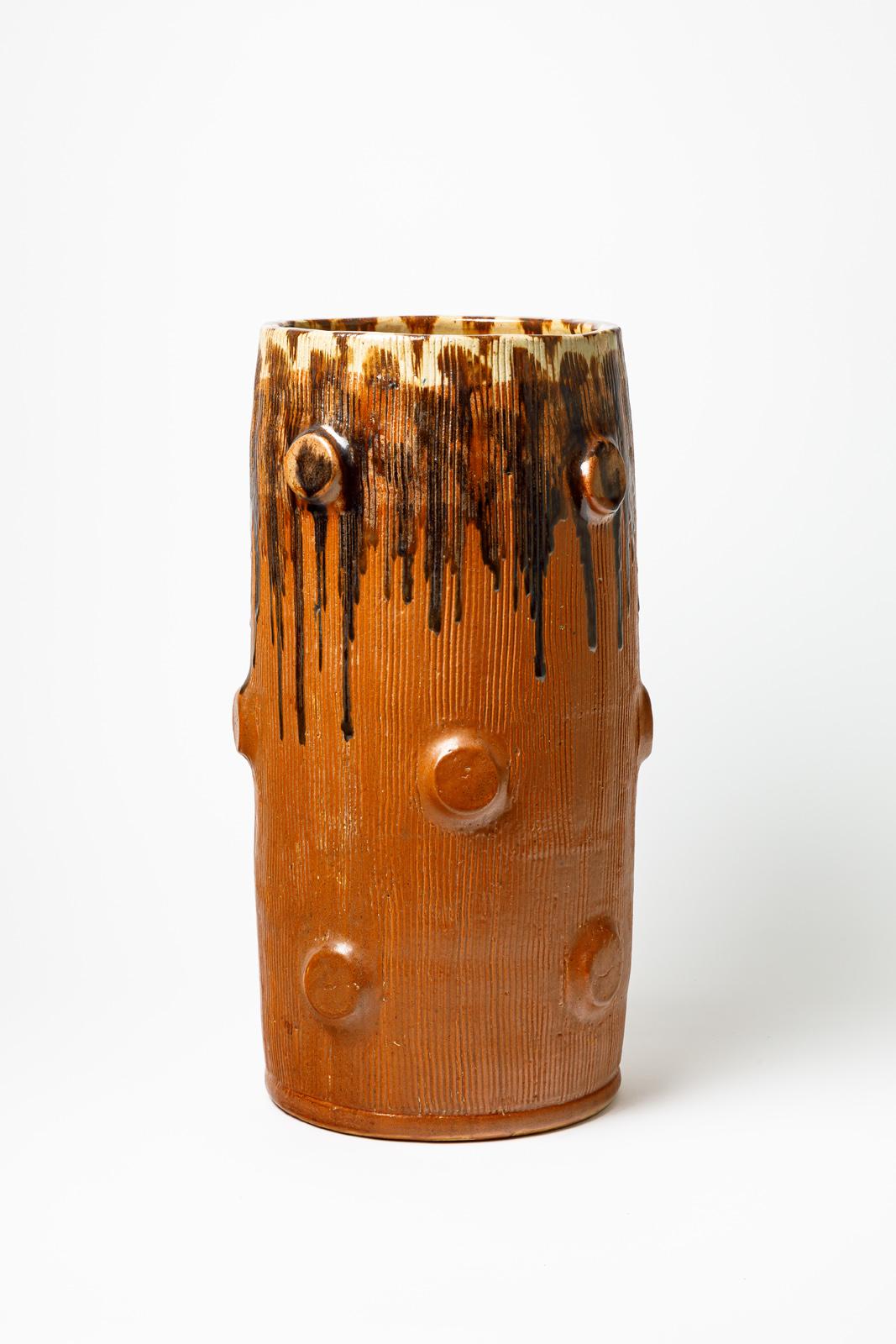 Orange and brown glazed ceramic vase by Joseph Talbot.
Artist’s monogram under the base. Circa 1940-1950.
H : 18.9’ x 9.1’ inches.