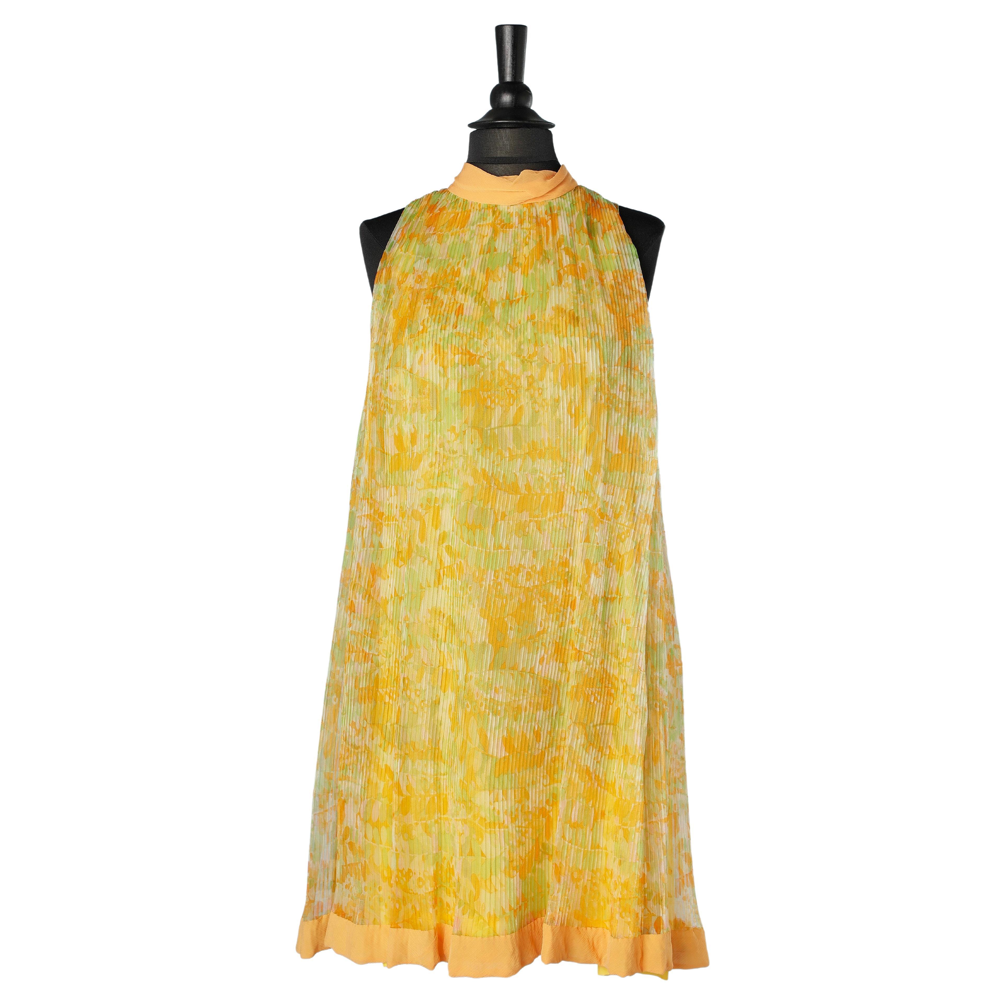 Orange and green flower print with sunray pleats and chiffon neck Circa 1960's For Sale