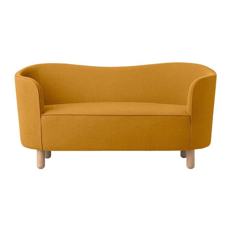 Orange and natural oak Raf Simons Vidar 3 mingle sofa by Lassen
Dimensions: W 154 x D 68 x H 74 cm 
Materials: Textile, oak.

The Mingle sofa was designed in 1935 by architect Flemming Lassen (1902-1984) and was presented at The Copenhagen