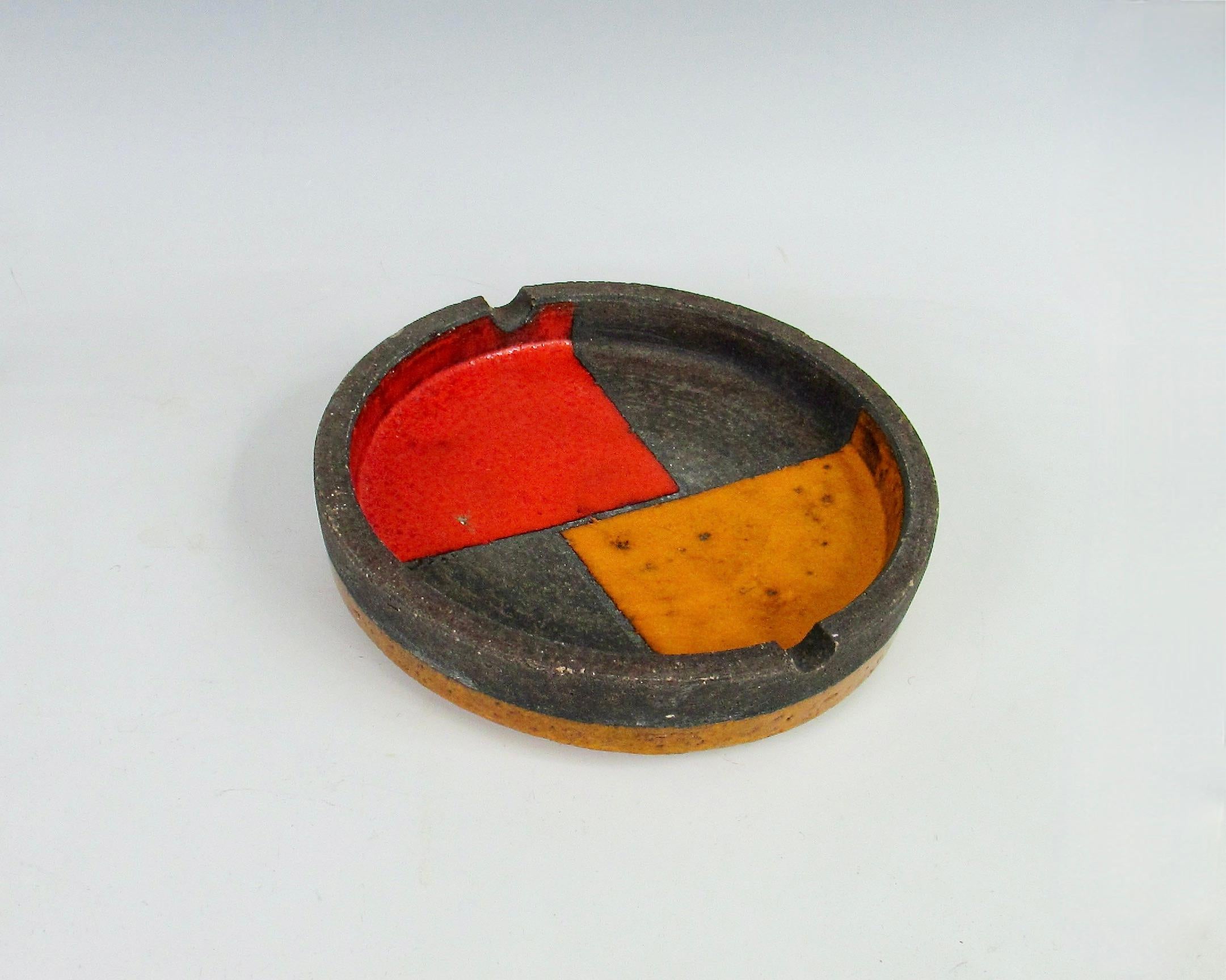 Glazed Orange and red round Italian pottery ashtray with chip For Sale