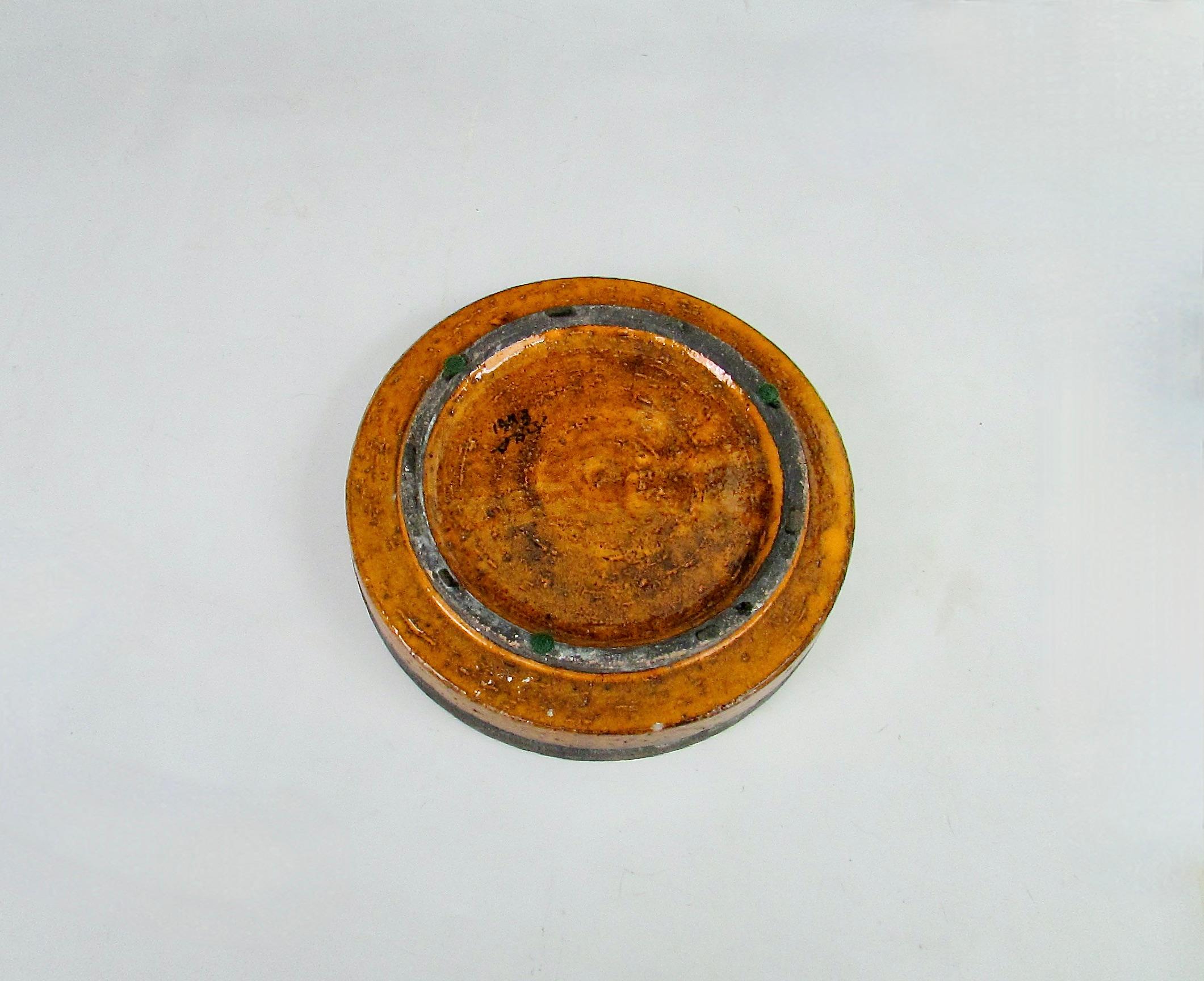 Orange and red round Italian pottery ashtray with chip For Sale 2