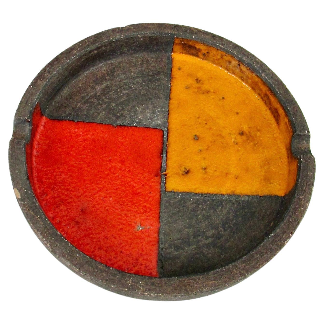 Orange and red round Italian pottery ashtray with chip For Sale