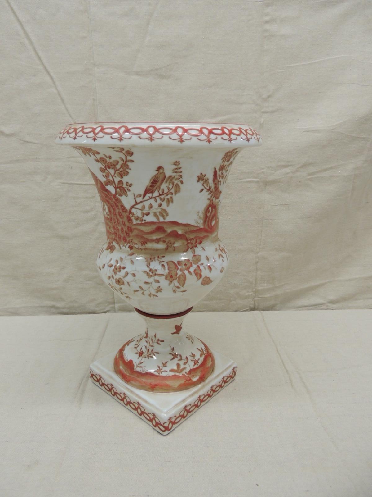 Orange and white ceramic urn
Depicting peacocks and trees
Trellis border on the base and the top ring
Size: 14