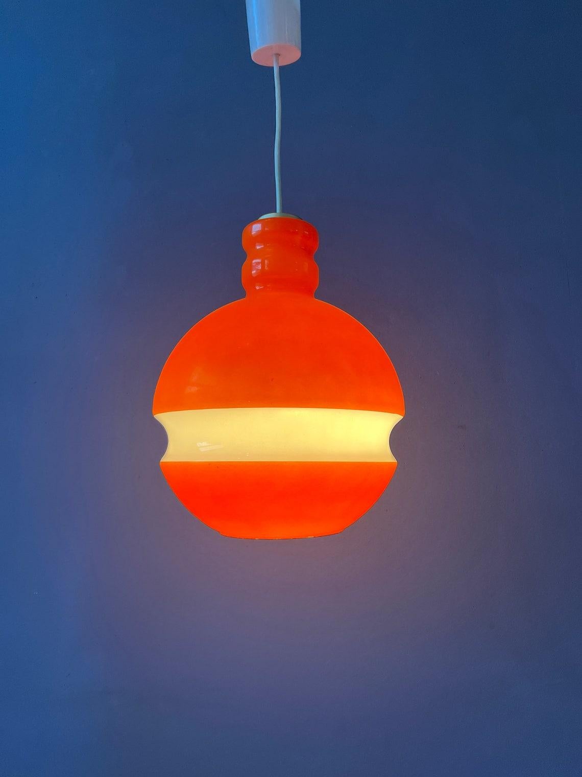 Orange Peill & Putzler space age glass pendant lamp. The orange and white parts together produce an amazing light effect. The lamp requires one E27/26 lightbulb.

Additional information:
Materials: Glass, metal
Period: 1970s
Dimensions:ø: 24