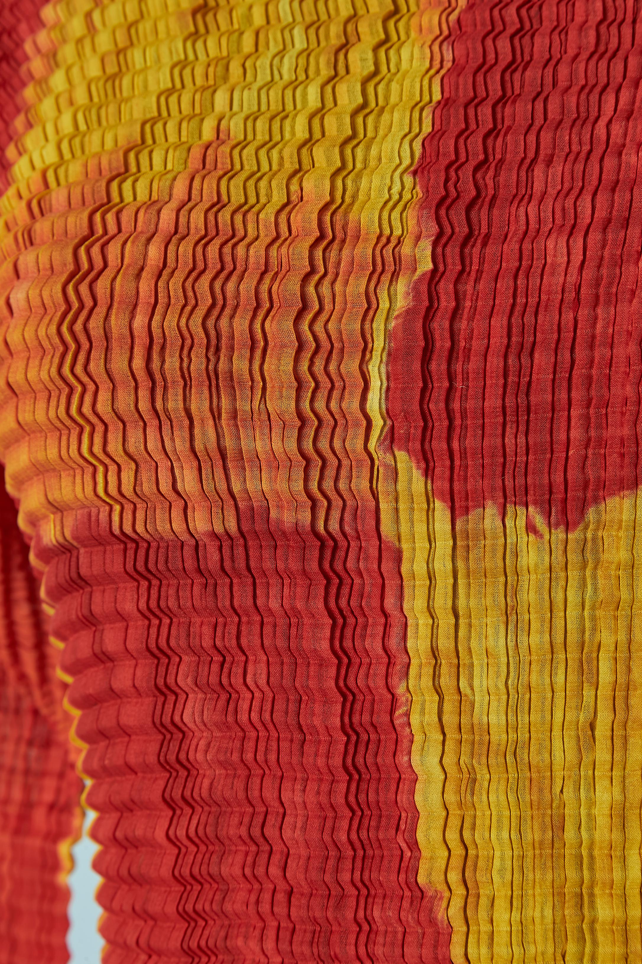 Red Orange and yellow pleated taÏ&daÏ long sleeve top Issey Miyake For Sale