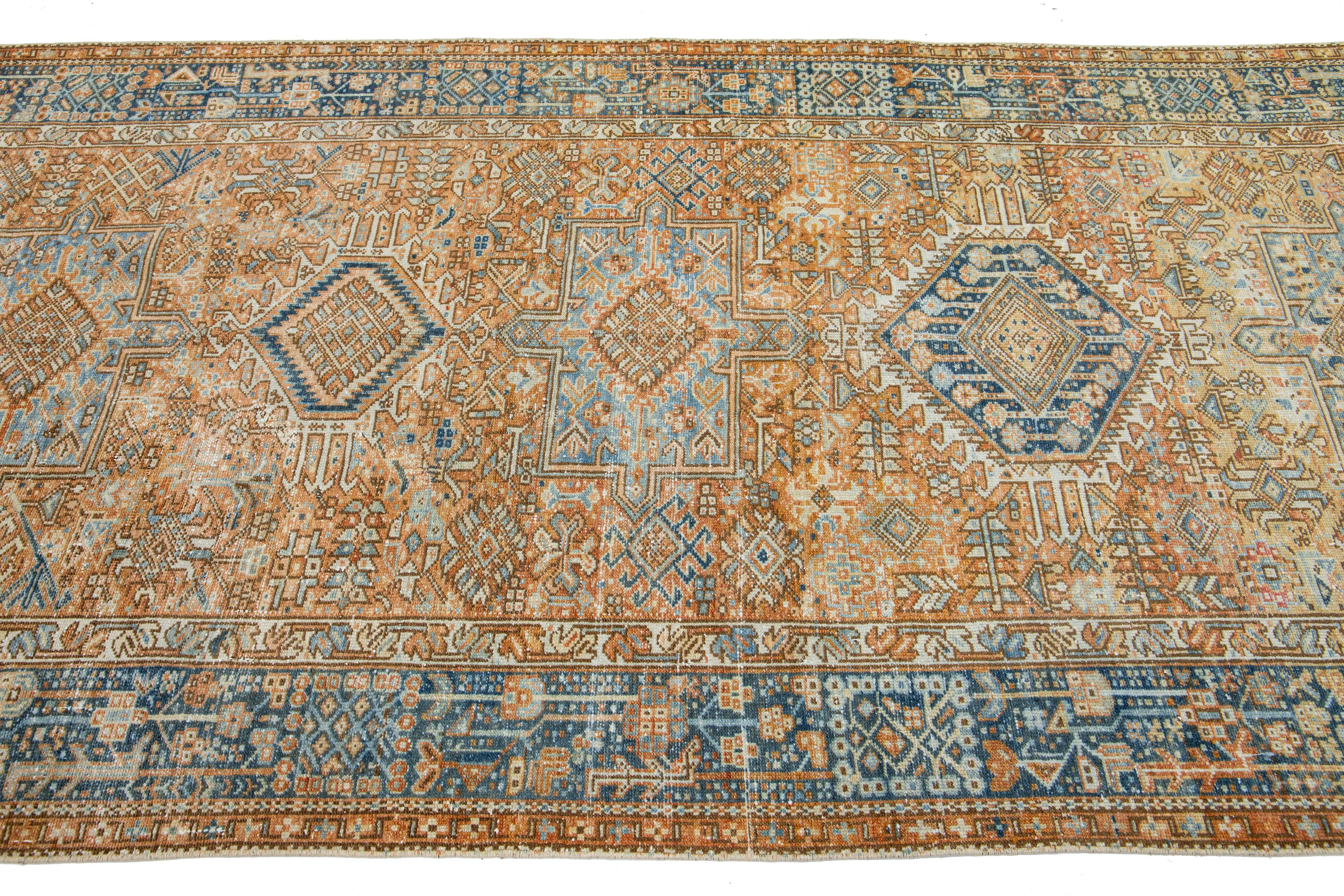 Persian Orange Antique Heriz Handmade Wool Runner featuring an Allover Geometric Motif  For Sale