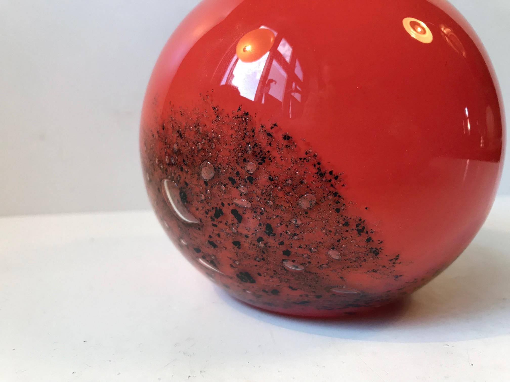 Colorful art glass vase by Czech designer Frantisek Koudelka. Hand blown orange glass with infused coal and air bubbles.