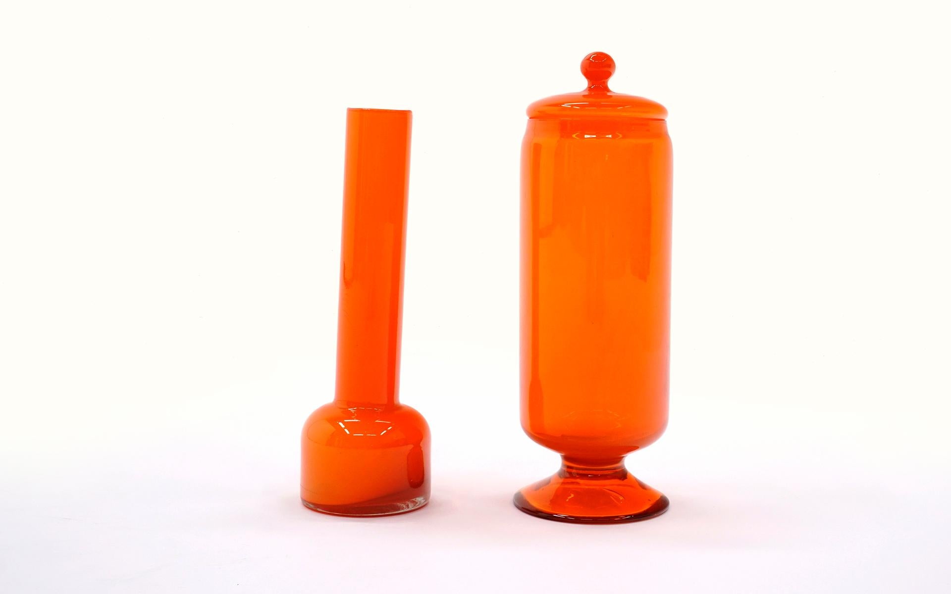 Orange art glass vase and canister / jar with lid attributed to Blenko. Priced each. Free shipping via FedEx in the Continental US arriving to you within 3-6 days of your order.