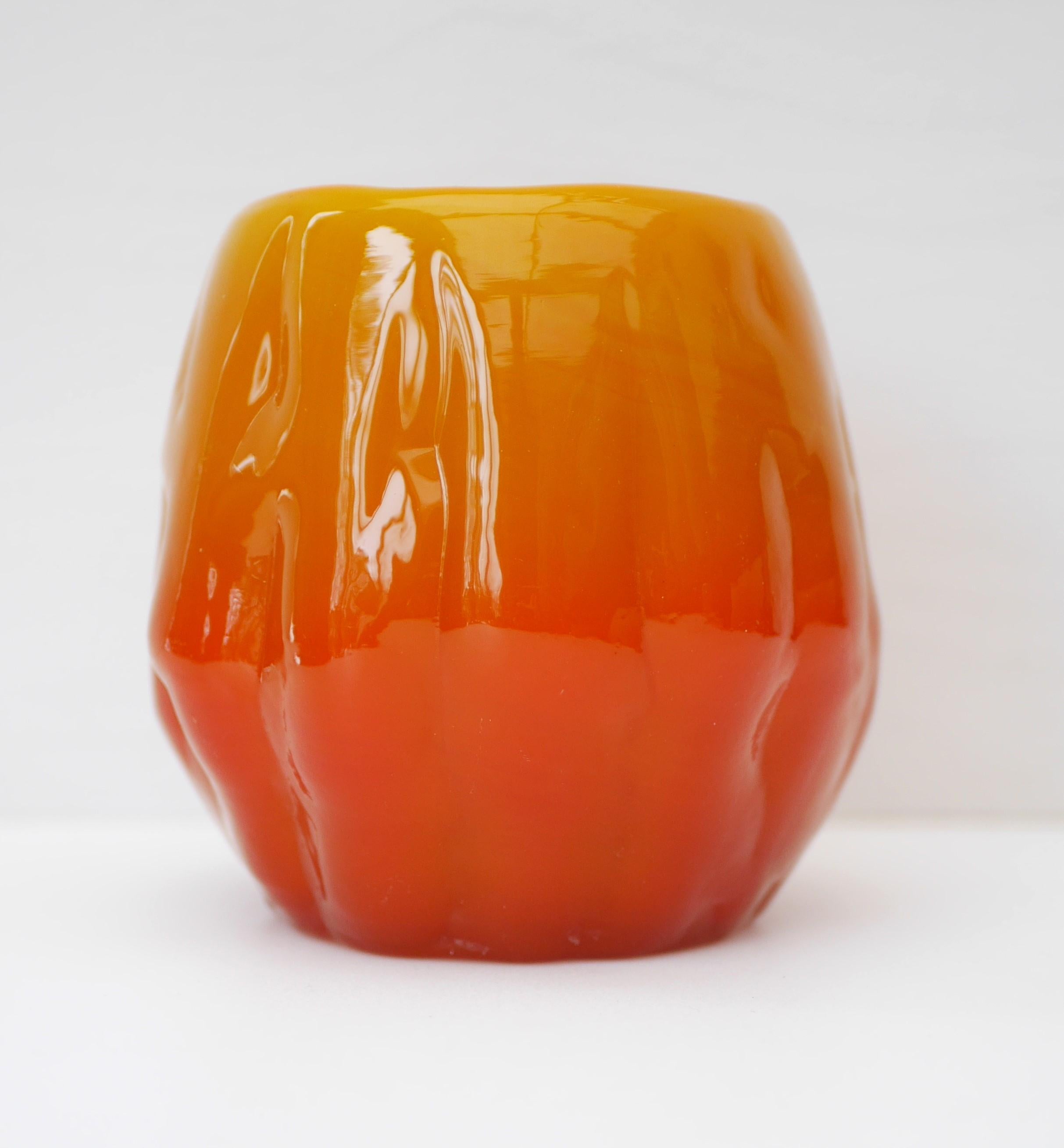 A stunning massive bright orange vintage glass vase from the Selena series, made by the talented Göte Augustsson for Ruda Glasbruk, Sweden. This is a very special piece with a bold design. It has a very bright orange base which fades into a yellow