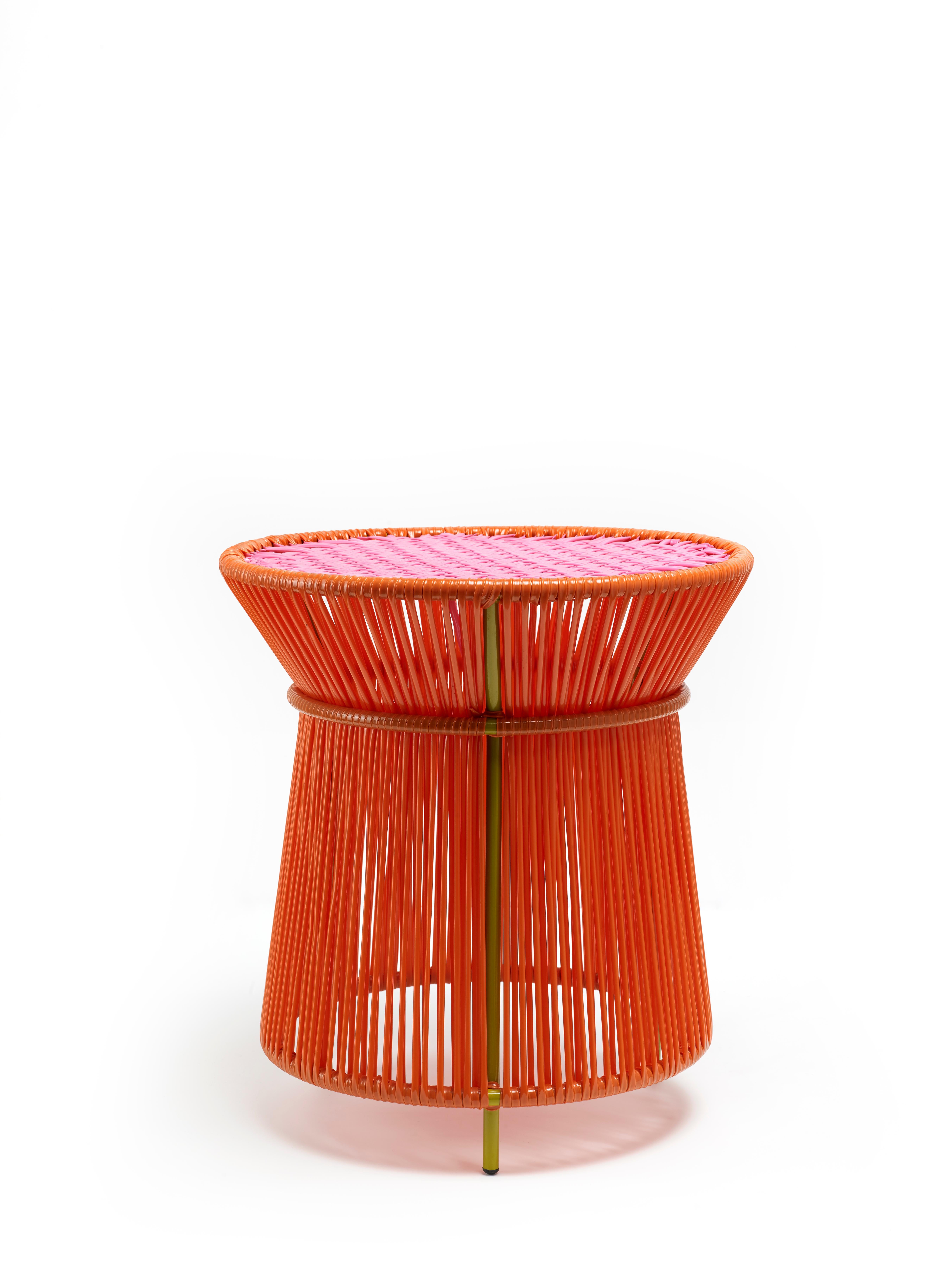 Orange Caribe high table by Sebastian Herkner
Materials: Galvanized and powder-coated tubular steel. PVC strings are made from recycled plastic.
Technique: Made from recycled plastic and weaved by local craftspeople in Colombia. 
Dimensions: