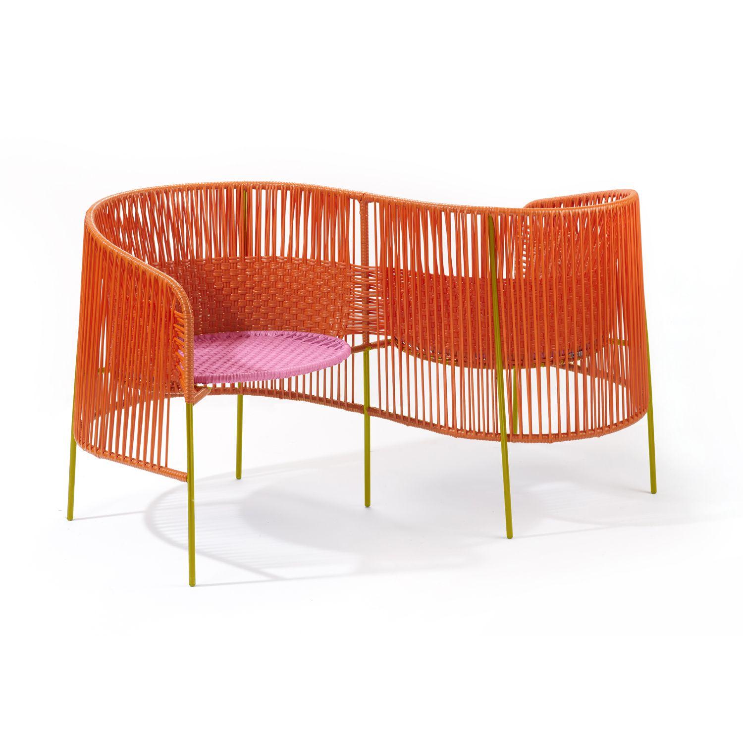 Orange Caribe Vis a Vis by Sebastian Herkner
Materials: Galvanized and powder-coated tubular steel. PVC strings are made from recycled plastic.
Technique: Made from recycled plastic and weaved by local craftspeople in Colombia. 
Dimensions: W 123.3