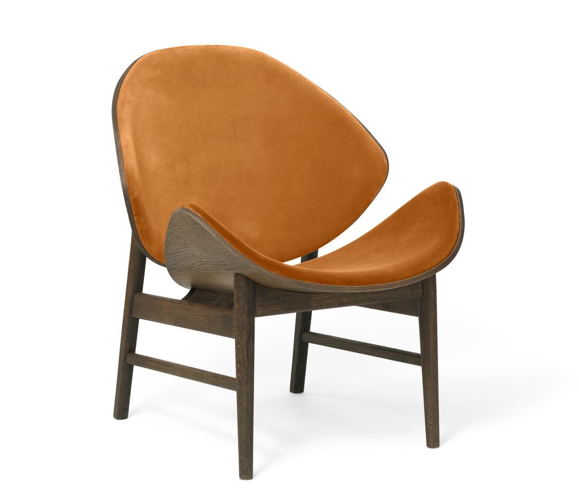 The orange chair ritz smoked oak amber by Warm Nordic
Dimensions: D64 x W71 x H 78 cm
Material: Smoked solid oak base, Veneer seat and back, Textile upholstery
Weight: 9 kg
Also available in different colours, materials and finishes. 

This