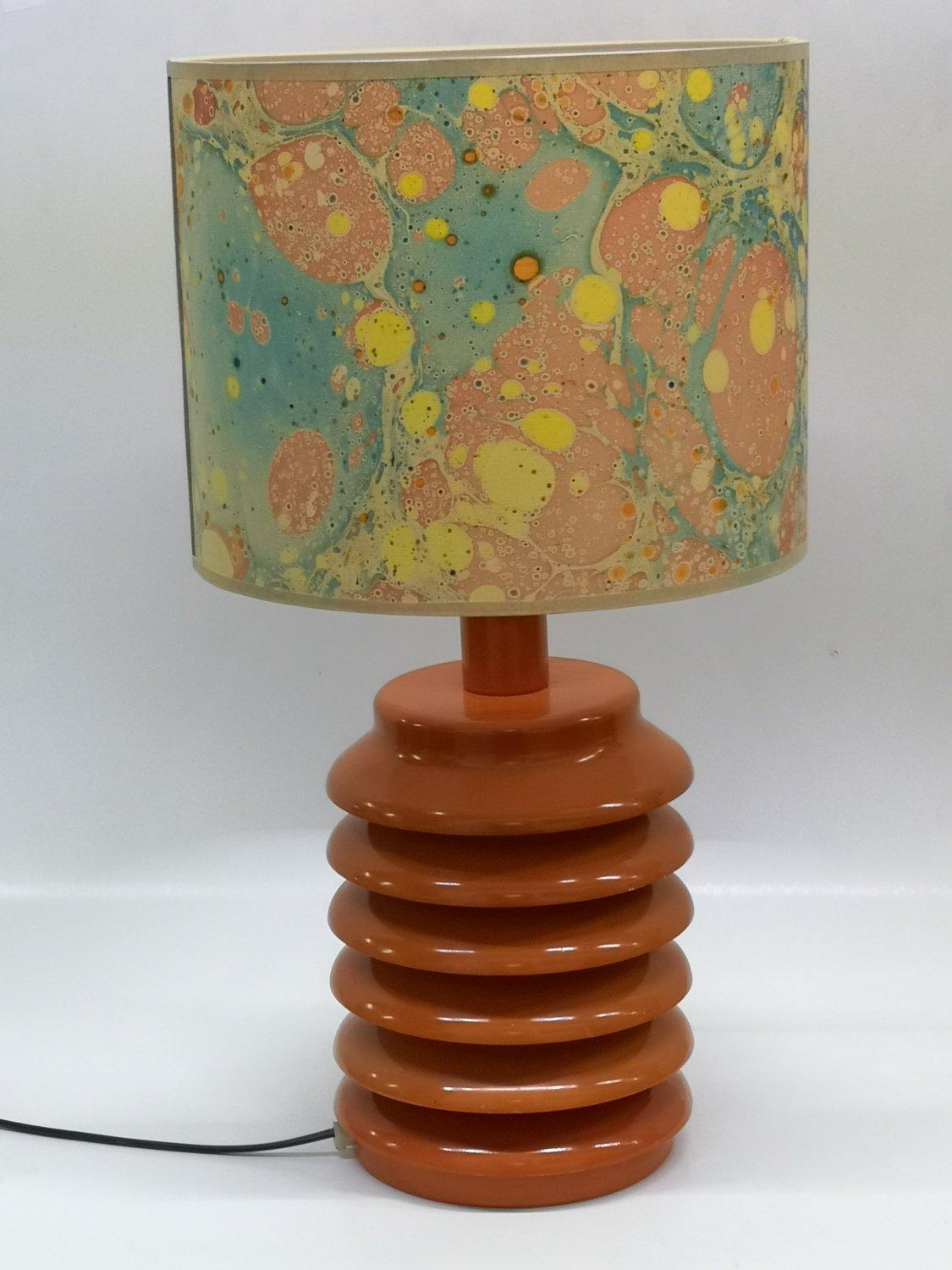 Specially formed midcentury modern lamp from the 1960's.
It is electricall modernized and has a distinctive lamp shade.
It can be a part of any enterior. Lamp shade's diameter: 30cm.