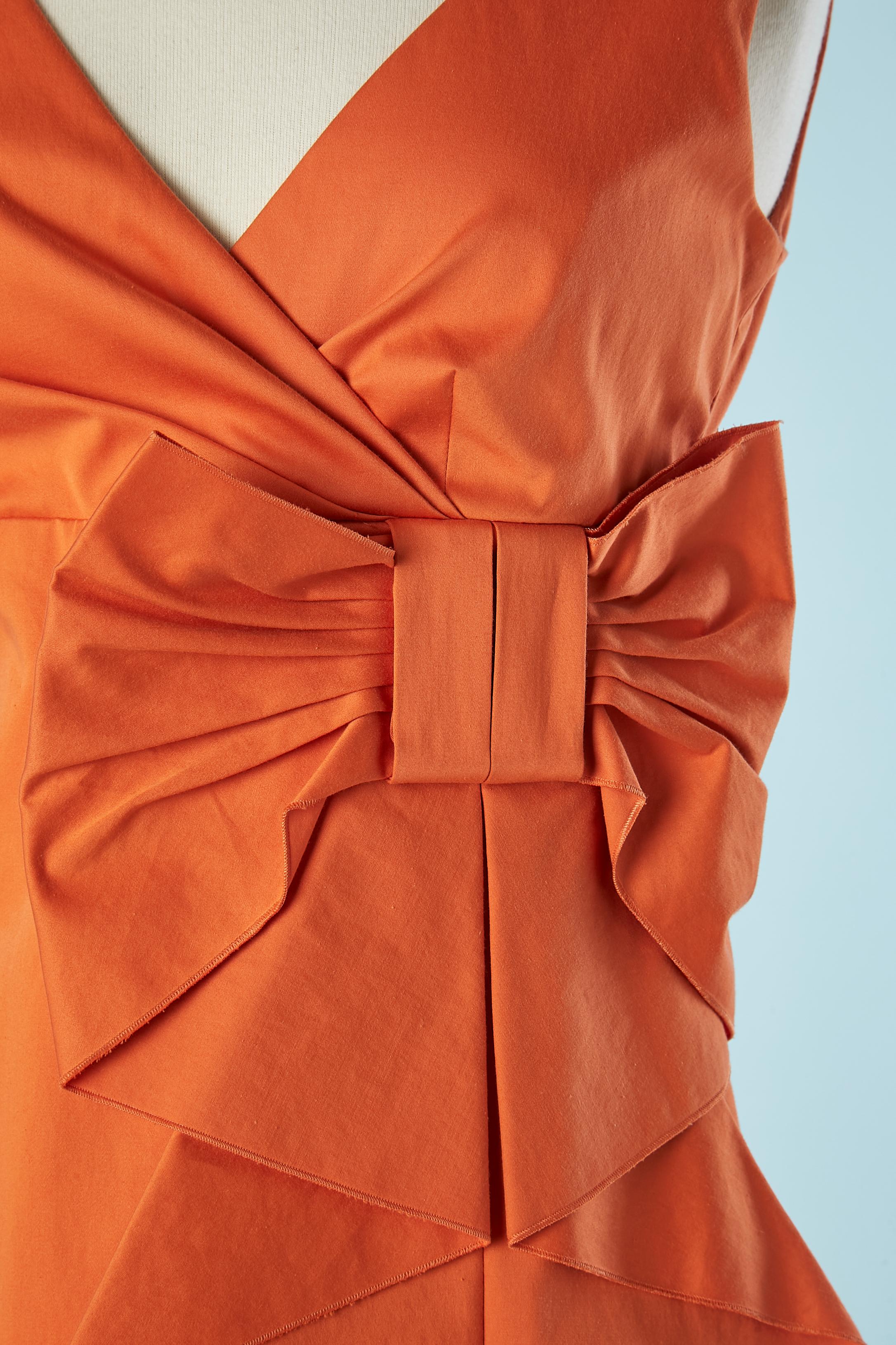 Orange cotton cocktail dress with bow. Fabric composition: 97% cotton, 3% elastane.
Lining: 67% acetate 33% polyester. 
Ruffle in the middle front. Split on the front on the side, lenght= 18 cm
SIZE 40 NEW with tag