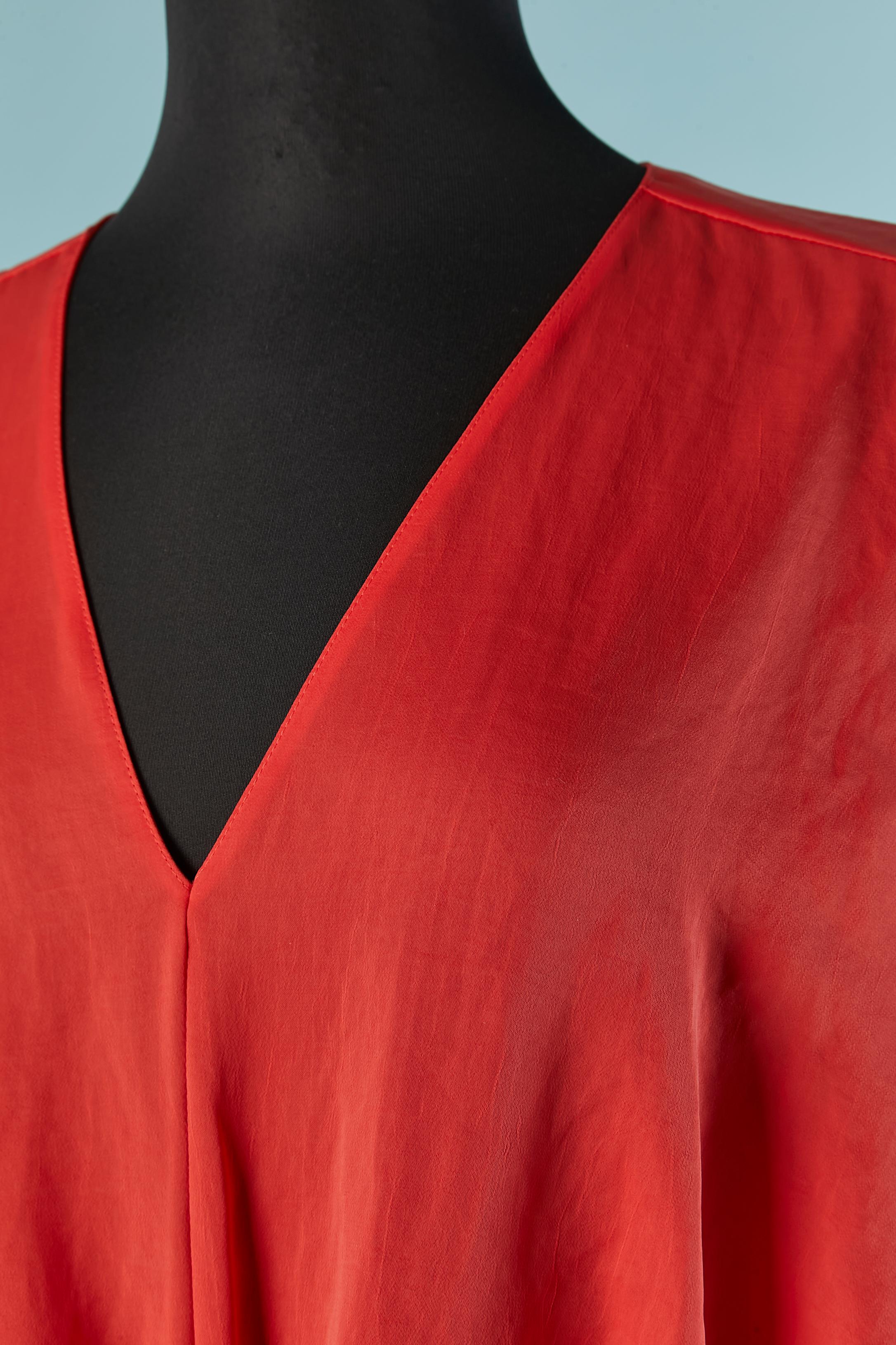 Orange day dress draped on the middle front. Main fabric composition: 100% polyester. White Lining: 70% acetate, 30% silk. 
Elastic band on the waist. 
SIZE 38 