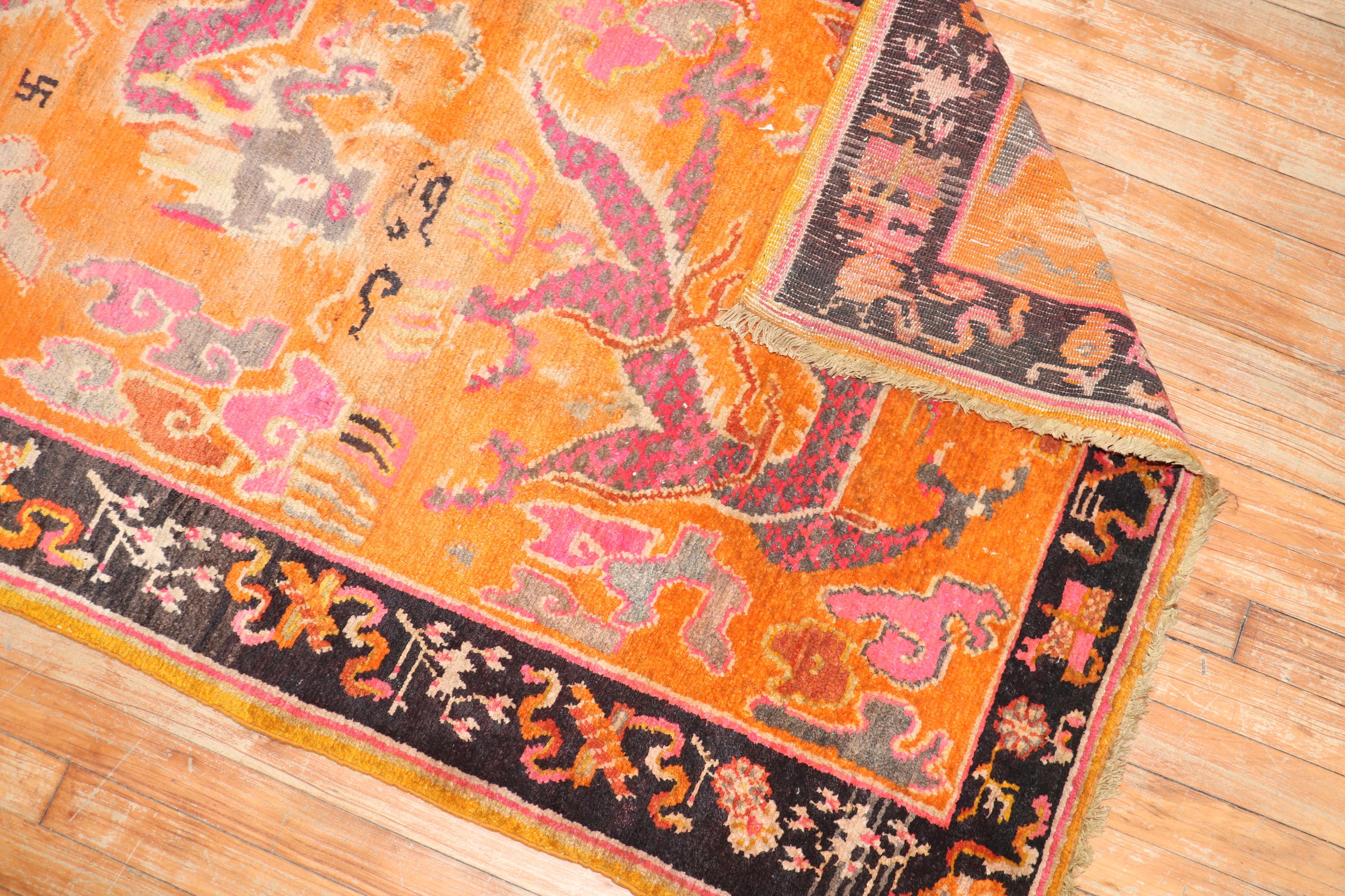Colorful one-of-a-kind Tibetan rug from the 2nd quarter of the 20th century with a dragon motif on a bright orange field

Measures: 3'4'' x 5'7''.