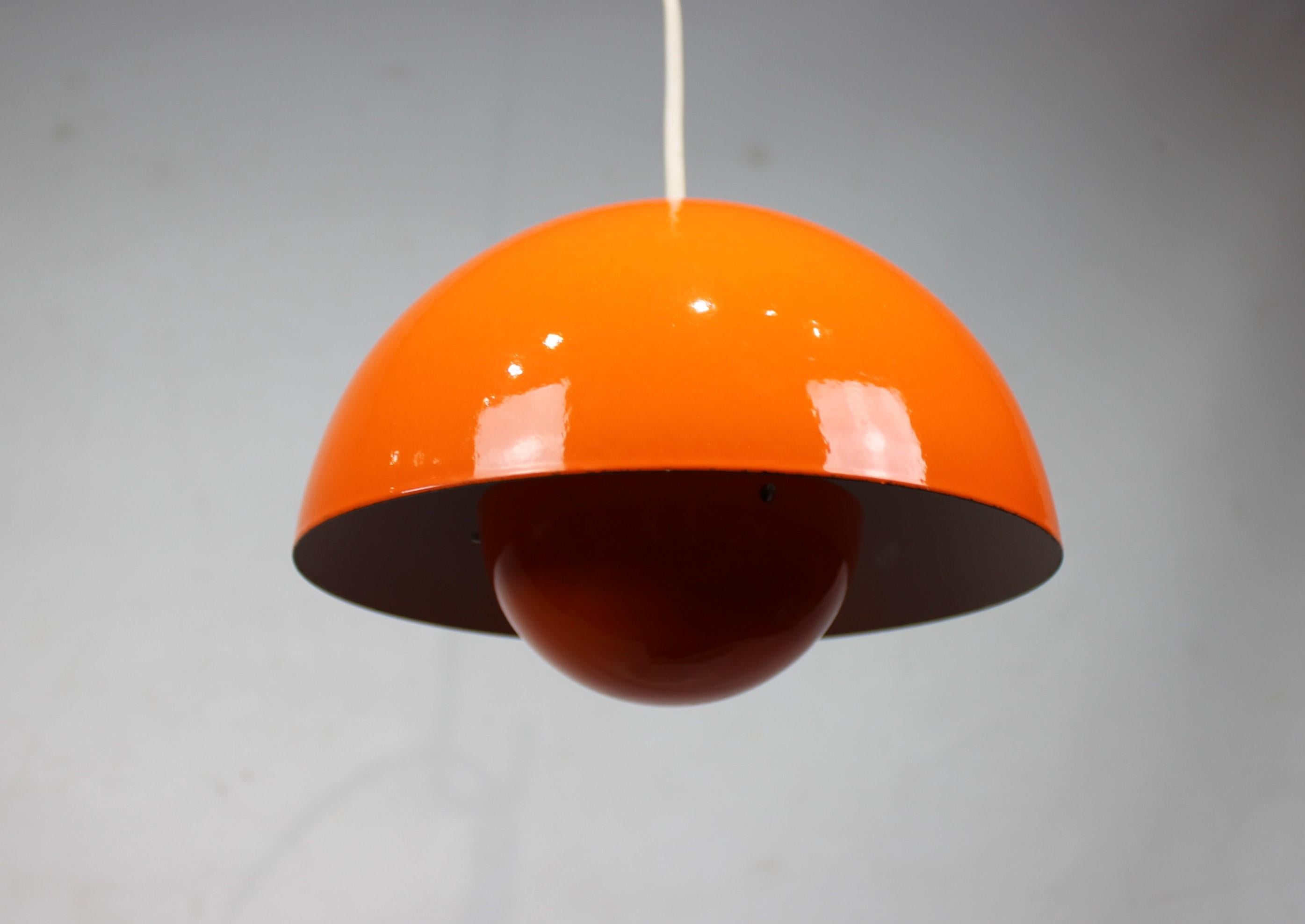 Orange flowerpot, model VP1, pendant designed by Verner Panton in 1968 and manufactured in the 1970s. The lamp is in great vintage condition and with original enamel.
  